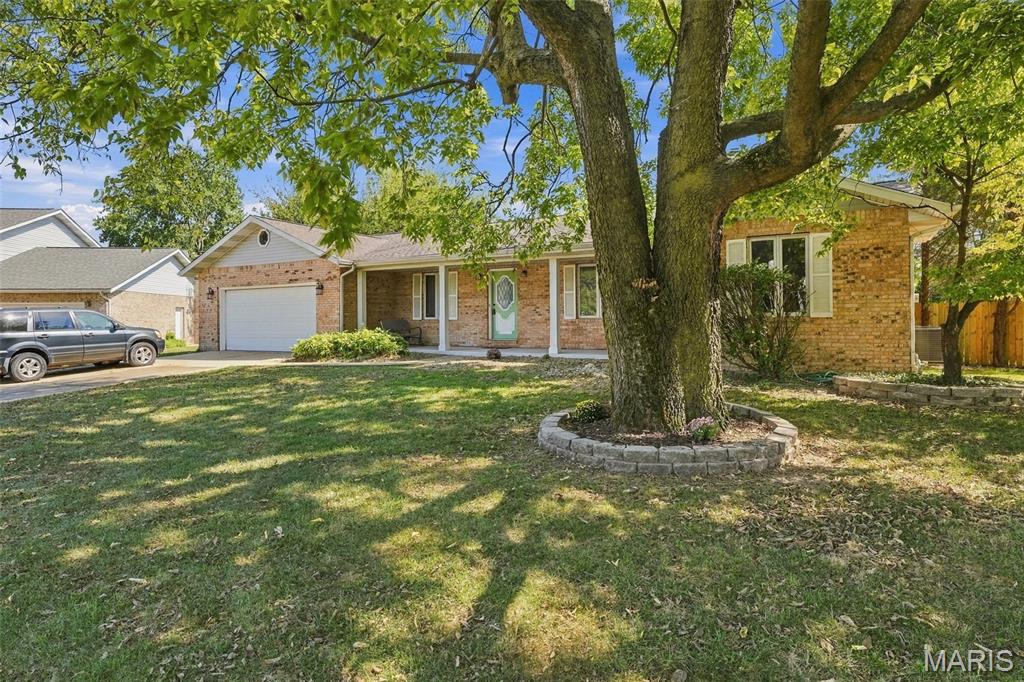 Welcome to 1727 Meadow Lane, Edwardsville, IL 62025!

Beautifully updated and move-in ready, this charming three-bedroom home offers a wonderful combination of modern upgrades, comfortable living spaces, and desirable outdoor features. Step inside to discover all-new flooring throughout and fresh paint that creates a clean, welcoming feel.

The spacious layout includes a separate dining room, an eat-in kitchen, formal living room and a large family room featuring a cozy wood-burning fireplace—perfect for relaxing or entertaining. The home also offers a full basement, providing plenty of space for storage, recreation, hobbies, or future finishing possibilities.

Enjoy the convenience and efficiency of a tankless water heater, along with numerous additional updates and upgrades throughout the home.

Outside, you'll love the large covered front porch, perfect for morning coffee or relaxing evenings. The backyard features a patio and fenced yard, creating a great space for entertaining, pets, gardening, or outdoor enjoyment.

The impressive two-car garage features epoxy-coated flooring, providing a clean, durable, and attractive space for vehicles, projects, and storage.

With its thoughtful updates, spacious living areas, fireplace, full basement, beautiful garage, and fenced-in outdoor space, 1727 Meadow Lane is ready to welcome you home!