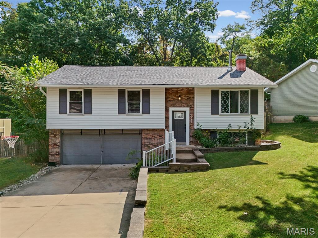 Welcome home to this beautifully refreshed 3-bedroom split-foyer! Updated flooring and paint give this home a clean, updated feel while maintaining its comfortable and inviting character. The spacious living area features a cozy wood-burning fireplace, perfect for relaxing or entertaining. The functional split-foyer layout offers versatile living space with room to accommodate a family room, home office, or recreation area. Step outside to enjoy the fully fenced-in backyard, offering a great space for outdoor gatherings, pets, or simply relaxing. With thoughtful updates, a desirable floor plan, and plenty of indoor and outdoor living space, this home is ready for its next chapter. Don't miss the opportunity to make it yours!