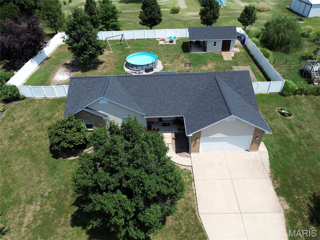 Move-in ready with an incredible list of updates, over 2,360 sq. ft. of finished living space(1600 sq.ft Main Floor), a .57-acre cul-de-sac lot, and an 16x15 outbuilding/workshop w/covered patio—this home truly has it all! This well-maintained 3BR/3BA home features a finished lower level and numerous recent improvements, including a newer roof, fascia, soffit, gutters, A/C unit, vinyl privacy fence and more. The main level offers vaulted ceilings, plant shelves, bay window, ceiling fans throughout, main floor laundry, and an inviting entry with sidelights. The spacious kitchen includes a breakfast bar, abundant cabinet space, and a patio door leading to the backyard. The primary features a vaulted ceiling, dual vanity, large linen closet, plant shelf and plenty of storage. The finished lower level adds a large family/rec room, full bath, and still leaves ample unfinished storage space. Outside, enjoy the privacy vinyl fenced backyard, patio, and detached outbuilding/workshop with concrete floors and electricity—perfect for hobbies, storage, or projects. With extensive updates, a fantastic large lot, and an established neighborhood, this home is one you won't want to miss! Troy R-3