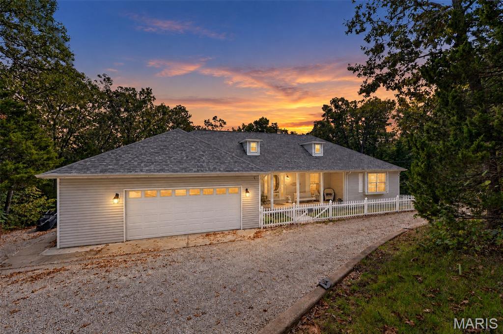 Welcome to this spacious three-bedroom ranch situated on 8.1 acres across two lots in a private, wooded setting! A circular driveway and covered front porch create an inviting entrance. Inside, the desirable split-bedroom floor plan features vaulted ceilings and hardwood flooring throughout the main living areas. The great room offers a wood-burning stove, ceiling fan and atrium doors leading to the generous 12' x 30' deck. A separate dining room provides additional space for entertaining.

The updated kitchen features stainless steel appliances, a built-in microwave, stylish backsplash and breakfast-bar island. The large primary suite offers three closets, direct access to the deck shared with the great room and a well-appointed bathroom with an adult-height vanity, slipper tub and separate walk-in shower. The spacious second bedroom includes a window seat, ceiling fan and double closet, while the third bedroom offers additional space for guests or a home office. Other highlights include six-panel doors, double-hung tilt-in windows and convenient main-floor laundry.

The nicely finished walkout lower level offers a spacious family room, full bathroom and ample unfinished storage space, providing plenty of room for relaxing and entertaining. Major updates include a new furnace and central air installed in April 2026 and an architectural-shingle roof approximately two years old. Additional features include central vacuum, 200-amp electrical service, vinyl siding and an oversized attached garage.

Outside, enjoy the above-ground pool, fenced front area, 8' x 8' metal shed and an 18' x 41' detached garage/outbuilding with a concrete floor, electric and garage-door opener. A subdivision park along the river provides another outdoor amenity. The safe can stay. Schedule your showing today!