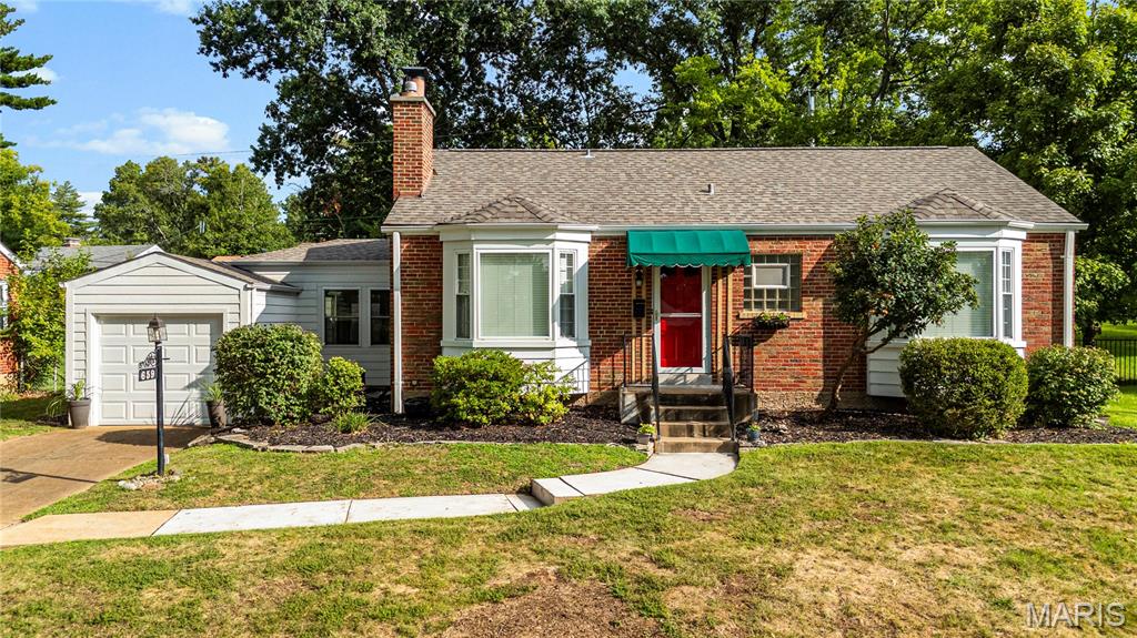 HUGE PRICE REDUCTION IN ADDITION SELLER PAID FOR NEW CARPETING IN THE LOWER LEVEL TO GIVE YOU AN EXTRA 400 SQ FT OF LIVING SPACE.  WITH THE EGRESS WINDOW YOU COULD BUILD A CLOSET AND HAVE A THIRD BEDROOM. ALREADY PASSED THE WEBSTER GROVE CODE OF COMPLIANCE INSPECTION. READY FOR A QUICK CLOSING. This charming brick home is full of character and offers wonderful curb appeal! Step inside to find beautiful hardwood floors, a decorative fireplace, and a bay window that creates a warm and inviting living space. The separate dining room is perfect for entertaining. The updated kitchen features crisp white cabinetry, granite countertops, a large farmhouse sink, and stainless steel appliances. The breezeway has been enhanced with a mini-split HVAC system, making this versatile space even more comfortable and enjoyable throughout the seasons. A door leads to the fenced backyard, complete with a lovely flagstone patio—perfect for relaxing or entertaining. The attached one-car garage has recently been rebuilt. 
The drywalled basement has recently been updated with carpet and has potential to add another bedroom with an egress window which was added by the seller. The furnace and air conditioner, including the unit serving the three-season room, have been serviced by the seller. Fantastic location close to a grade school, Webster Recreation Center, shopping, restaurants, and more. Charming, updated, and ready for you to make it home!