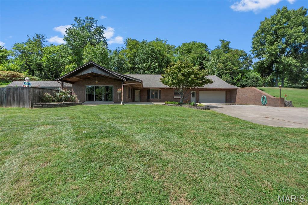 Wow this one checks all boxes! Secluded with lots of trees on the 8.82 acres! Take a deep breath before you enter this amazing home, you're gonna need it! This efficient earth home features 5+ bedrooms (4 on main level, 1 plus bonus room up), 5 bathrooms (3 full-2 half (1 is in the pool house), huge living room with fireplace and open floor plan to the dining room and kitchen. Big 2 car attached garage, in ground concrete swimming pool. This one is move-in ready. So much to tell about this property. Check out the 3-D tour and join us for an open house on Saturday, August 29 from 3 to 4:30 pm.