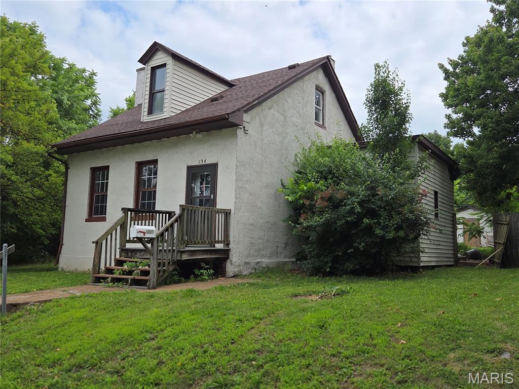 Fantastic Opportunity to live in main home and have 1 bedroom rental in rear. Home has 3 large bedrooms and 1 full and 1 3/4 bath with main level laundry. Needs cosmetics but home has some updates throughout. Rear home is 1 bed and 3/4 bath with living room and kitchen. Would be great for 1 or 2 people to have an income from. Huge corner lot in a historical neighborhood close to downtown Belleville. A must see to appreciate. This home is being sold as is from a private investor.  Seller requires 72 hours to respond to all offers. Will only sell as is and will not provide for inspections. (Electricity only). Buyer to get own occupancy inspection and may have water turned on temporary for own inspection purposes. Seller will have home in broom swept condition.  This is a great opportunity and priced very well as a private residence or an income producing property.