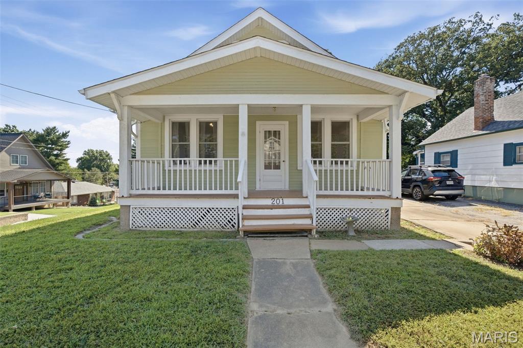 Historic charm, a fantastic location, and plenty of potential! Situated on a desirable corner lot in the heart of St. Charles, this home is just steps from the Katy Trail and historic downtown St. Charles, with convenient access to shopping, dining, entertainment, and just 10 minutes from St. Louis International Airport.
Inside, you'll find beautiful original woodwork, wood floors, a welcoming living room, and a formal dining room that showcase the character of this historic home. The kitchen features stainless steel appliances, a large pantry, and opens to an additional family room with a fireplace. From there, step down into a bright sunroom with vaulted ceilings—an ideal space for relaxing, entertaining, or creating your own favorite spot in the home.
The main level offers one bedroom, with a second bedroom upstairs. An unfinished basement provides abundant storage space, with some finished/paneled areas, and the washer and dryer are included in the sale.
Outside, enjoy the large, fenced yard, spacious deck, welcoming front porch, corner lot, and long driveway. A detached one-car garage provides additional storage space. 
Recent updates include a newer roof, 2025 water heater, and newer HVAC, providing a solid starting point for the next owner. This is a home with historic character, an unbeatable location, and the opportunity to bring your vision to life!