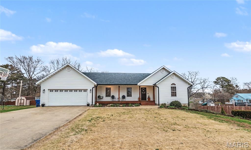 Beautifully maintained home located in a desirable neighborhood, offering space, comfort, and convenience. This 4-bedroom home includes a main-level primary suite, a dedicated office, and 2.5 baths, providing plenty of room for both everyday living and working from home. The main level features beautiful hardwood floors throughout and a kitchen with solid oak cabinets that offer both durability and timeless appeal.  Just off the dining area, step out onto the back deck, perfect for entertaining guests, grilling, or enjoying quiet evenings outdoors. The fully finished walk-out basement adds even more living space and includes the half bath, office, one of the bedrooms, a convenient kitchenette, and a living area, making it ideal for gatherings, guests, or multi-generational living.  Outside, you'll find a fenced-in backyard with a privacy fence, creating a great space for pets, kids, or relaxing in your own private setting. The home also includes an attached 2-car garage for added convenience and storage. Major exterior updates have already been completed, including a new roof, siding, wrapping, and guttering installed in September 2024, giving peace of mind for years to come. Located just 25 minutes from the beautiful Current River, this property offers the perfect blend of comfortable living, being close to town, and easy access to some of the area's best outdoor recreation. *Fireplace & mantel are not affixed and will not stay with the home.