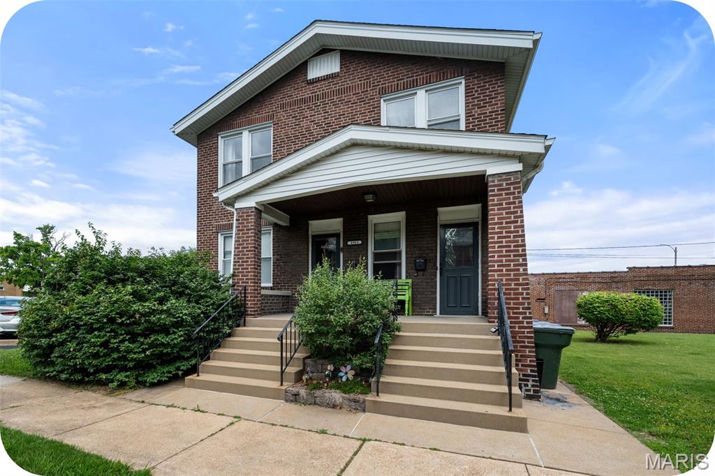 Caught between pasta, peonies, and park picnics? That’s exactly where you want to be. This quintessential brick 2-family sits in the sweet spot between The Hill, Missouri Botanical Garden, and Tower Grove Park — making the location alone hard to beat. Fortunately, the building keeps up. This brick beauty serves up all the character buyers hope for: classic center-hall floor plans, hardwood floors, sunny living spaces, charming architectural details, and a covered front porch practically begging for morning coffee or evening wine. Each unit offers 2 spacious bedrooms, a full bath, bright living room, eat-in kitchen, and a flexible bonus room. The kitchens are both updated with newer cabinetry, butcher block counters, gas ranges, built-in microwaves, dishwashers, and pantry storage. Both units have been thoughtfully updated in their own distinct style — polished without losing their soul. The clean basement is surprisingly impressive with a full drain tile system, two lockable storage closets, and washers and dryers. Outside, enjoy a fully fenced yard, patio area, oversized 1-car garage, and a newer roof already checked off the list. Central air in both units, radiator heat upstairs, and a level of maintenance that makes “move-in ready” actually mean something. Whether you’re looking to owner-occupy, invest, or simply live dangerously close to some of St. Louis’ best food, this one delivers.