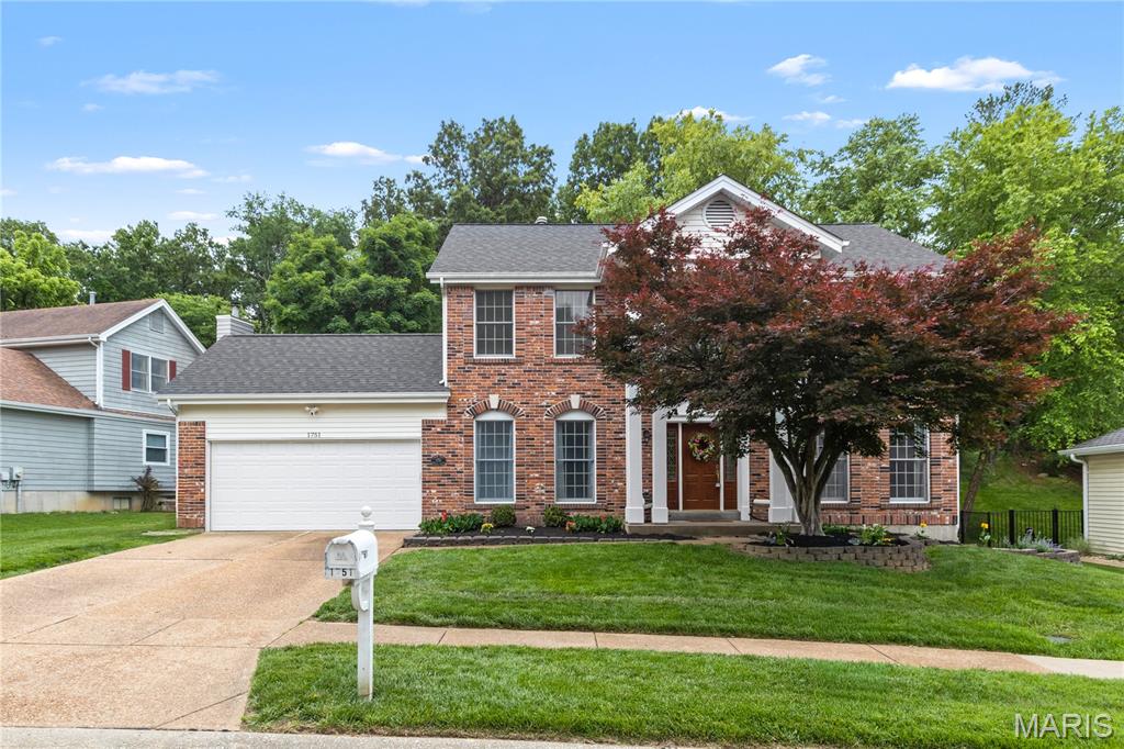 STATELY Two-Story Center-Hall Colonial with 4 Bedrooms and 3 and a Half Baths in Wildwood. Located in the highly desirable Timber Ridge Estates subdivision, this spacious Home has over 3100 square feet of living area. The main floor features a grand two-story entryway flanked by formal living and dining rooms. The Eat-In Kitchen has lots of cabinet space with a center island and breakfast room and is open to the large Family Room with a gas Fireplace. A main floor Laundry and Half Bath complete the first floor. Upstairs are the 4 Bedrooms and 2 full bathrooms including the Vaulted Primary Suite with walk-in closet and attached bath with separate tub and shower. The lower level features an additional 600+ square feet of finished space, a 3rd Full Bathroom, new flooring (2022), and plenty of storage. Private backyard with paver patio (2022) backs to woods with trails to a park. Quarter acre plus Lot. 2 car attached garage. NEW ROOF 2019. Subdivision Pool is located just 8 doors down. Very Family-friendly neighborhood. Rockwood Schools.