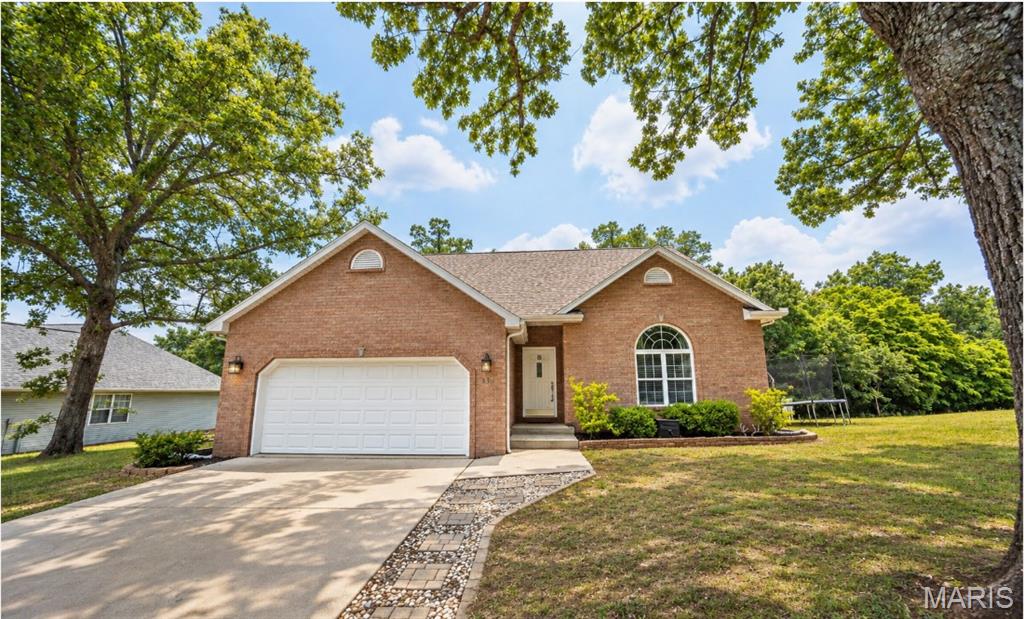 Located in one of the area’s most desirable subdivisions just minutes from Fort Leonard Wood, this stunning 5-bedroom, 2.5-bath home offers the perfect balance of modern comfort, style, and functionality. From the moment you arrive, you will notice the inviting curb appeal and beautifully maintained exterior, including a roof that is less than a year old. Step inside to discover an open and airy floorplan designed for both everyday living and entertaining. High ceilings and abundant natural light create a bright, welcoming atmosphere, while luxury vinyl plank flooring throughout the main living areas adds warmth and durability. The spacious living room centers around a beautiful fireplace, making it the perfect place to gather with family and friends. The kitchen is truly the heart of the home, featuring granite countertops, stainless steel appliances, ample cabinetry, and a walk-in pantry that provides exceptional storage and convenience. Just off the main living area, the oversized deck offers the ideal space for outdoor dining, relaxing evenings, or weekend cookouts. The main-floor primary suite provides a peaceful retreat with a spacious walk-in closet and a beautifully appointed bathroom designed for comfort and privacy. Upstairs, the additional bedrooms feature soft carpeting and flexible space for family, guests, or a home office. This home combines location, space, and modern finishes in one incredible package. Schedule your private showing today and experience everything this beautiful property has to offer!