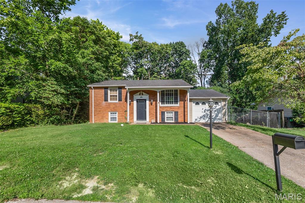 Welcome to this well maintained 3 bed 2 bath home with great backyard space! Open floor plan with eat in kitchen and deck off the kitchen area. 2 generous sized bedrooms on the main floor and a full bath. Lower level features a family/rec room and an additional bedroom with attached half bath. From the lower level newer sliding glass doors with built in blinds lead out to concrete patio and fenced in yard. See this home today and don't miss out!