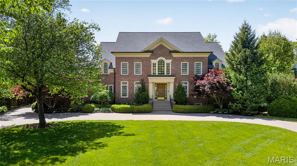 Welcome to one of the Gems of Fair Oaks! A beautiful multi-faceted 1.5 Story home located in the Ladue School District. Gorgeous grounds with paver circular drive takes you to the impressive front door. Note the extensive moldings and millwork throughout the home.  Enter and be greeted by beautiful oak floored foyer and a dramatic curved staircase.  Study features 10' tall box beam ceiling & custom built-ins, spacious dining room with butler pantry. The open great room has 14 ft ceiling, architectural columns, fireplace, and built-in bookcases plus expansive windows to rear yard draw you into the heart of the home. The spectacular kitchen has been updated with newer gas cooktop, refrigerator, dishwasher, magnificent marble countertops, plus an 8ft center island.  The breakfast room has sliding doors to the large deck and unfolds into the vaulted 15ft ceiling hearth room with floor to ceiling stone fireplace. The main floor master suite has coffered ceiling 12ft high at tallest point, walk-in closet and luxurious bath.  Front & back staircases access 4 additional bedrooms, 2 with ensuite baths and 2 with a Jack n Jill bath on 2nd floor. Lower level includes 6th bedroom/office which shares a full bath with exercise room, recreation room with built ins and 2nd kitchen area,  guest 1/2 bath, and  hobby room.   French doors open to outdoor living area with 2 patios and deck. Attached 2 car garage & 3 car garage/carriage house with apartment above featuring kitchenette, full bath an open room easily divided into bedroom and living space. Full Masonry exterior. Extensive landscaping.  This is the perfect house to relax, entertain and enjoy.  So many facets to view.