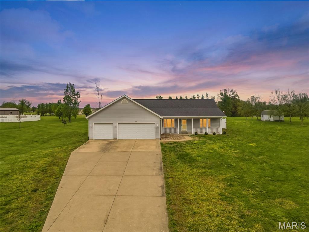 Welcome home to the perfect blend of peaceful country living and everyday convenience! Nestled on 3 acres in a quiet subdivision in unincorporated Foley and located in the desirable Winfield School District, this 3-bedroom, 3 full bath ranch offers the space, comfort, and lifestyle you've been looking for. Motivated sellers make this an opportunity you won't want to miss! Designed with a desirable split-bedroom floor plan, this home features main floor laundry, 6-panel doors, and tinted windows for added privacy and energy efficiency. The kitchen includes a reverse osmosis water filtration system, and the home is wired for surround sound, making it easy to enjoy movie nights or entertaining. The updated finished lower level offers even more living space with new luxury vinyl plank flooring, fresh paint, and endless possibilities. Create the perfect recreation room, home office, fitness area, craft room, or utilize the two additional sleeping rooms to fit your needs.  Step outside and discover your own backyard retreat! The above-ground pool, hot tub, pergola, fire table, patio furniture, and storage shed can all stay, allowing you to start enjoying your outdoor oasis from day one. Rain barrel-ready gutters and plenty of open green space add even more appeal for gardening, recreation, or simply soaking in the peaceful surroundings. The oversized 3-car garage provides plenty of room for vehicles, storage, and hobbies. Recent updates include HVAC (2023), roof (2019), soffits, fascia, and gutters (2025), along with new carpet in bedrooms two and three, giving buyers added confidence and peace of mind. If you've been dreaming of room to spread out while still enjoying an easy drive to town, this move-in ready property delivers. Schedule your showing today and see why these motivated sellers are ready to make your country-living dreams a reality!