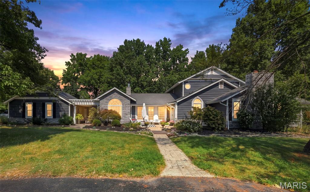 Discover a refreshing alternative to the traditional architecture in this beautifully renovated home, tucked away on over an acre with park-like setting. Designed to feel like a private and tranquil retreat, the outdoor space is highlighted by an inviting inground pool with concrete patio surround—perfect for relaxing, entertaining, and enjoying summer days at home. Inside, the thoughtfully updated custom floor plan. Luxurious main-floor primary suite has walk-in closet and custom walk in slate rain shower in en-suite. Open concept kitchen with luxury cabinetry, grand center island, granite countertops and SS appliances, walk-in pantry. Updated lighting features, dining and living room featuring french doors, arched doorways, ceiling beams, and more. The walk-out lower level adds even more flexible living space with a recreation room, wood-burning stove, and additional bedroom. A new roof, updated hvac and water heater, attached two-car garage with extra width, generous driveway, and extensive recent renovations add to the home's appeal.  Plenty of room to build additional garages. Showings are available to preapproved buyers only. Open house Friday 9/11 4–6PM and Sunday 9/13 1–3PM.