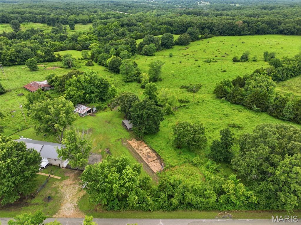 Escape to the peace and beauty of country living with this beautifully updated 4-bedroom, 2-bath home situated on 16.5 fully fenced acres in Newburg. Featuring rolling pastures, scattered mature trees, and a charming pond, this property is ideal for horses, livestock, hobby farming, or anyone looking to enjoy wide-open spaces and a slower pace of life.

Inside, you'll find a bright, welcoming interior with fresh paint throughout, hardwood flooring in the main living areas, durable vinyl flooring in the kitchen, and brand-new ceiling fans and most light fixtures that add a modern touch. The spacious layout is designed for comfortable everyday living, while the oversized primary suite offers a relaxing retreat complete with a large ensuite bath featuring a dual vanity.

This home has been thoughtfully maintained with major updates already completed, including a new roof in 2026, HVAC replaced in 2022, new septic tank and lateral lines in 2022, a well pressure tank replaced in 2023, and a newer water heater—providing peace of mind for years to come. The extra-deep garage offers abundant room for vehicles, equipment, tools, or a workshop.

Whether you're sipping coffee while overlooking your pasture, casting a line in the pond, or enjoying evenings under the stars, this property offers the perfect blend of comfort, privacy, and functionality. Don't miss this rare opportunity to own a move-in-ready home with acreage in the heart of Missouri. Schedule your private showing today and experience everything this exceptional property has to offer!