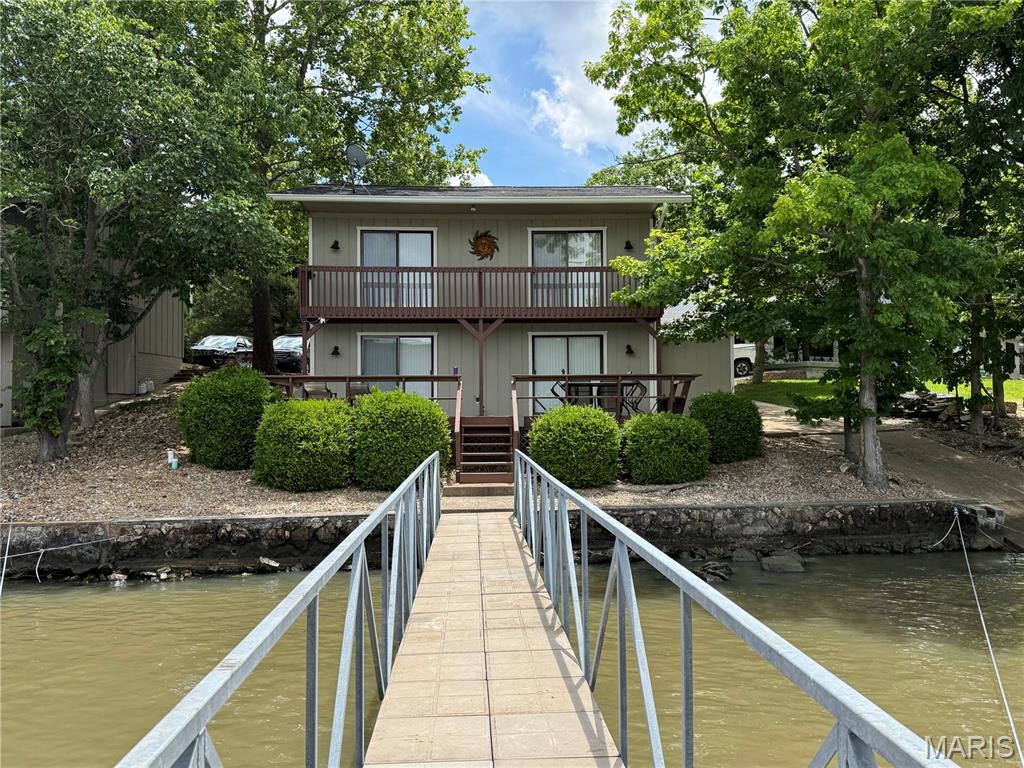 Are you ready for lake life, if so, here is the perfect get away for you. 1400 sq ft lake house 3 bedroom, 2 bath, with galvanized/concrete dock, including 2 slips for your boats or toys, one 23'x 10' and one 33'x14'. Relax and enjoy yourself on the large 8'x 30' sun deck, float on rafts in deep calm water, throw out a line for fishing, and watch great views of the lake including spetacular sunsets. includes your own private boat ramp. Only 5 steps down to the lake, from your deck.