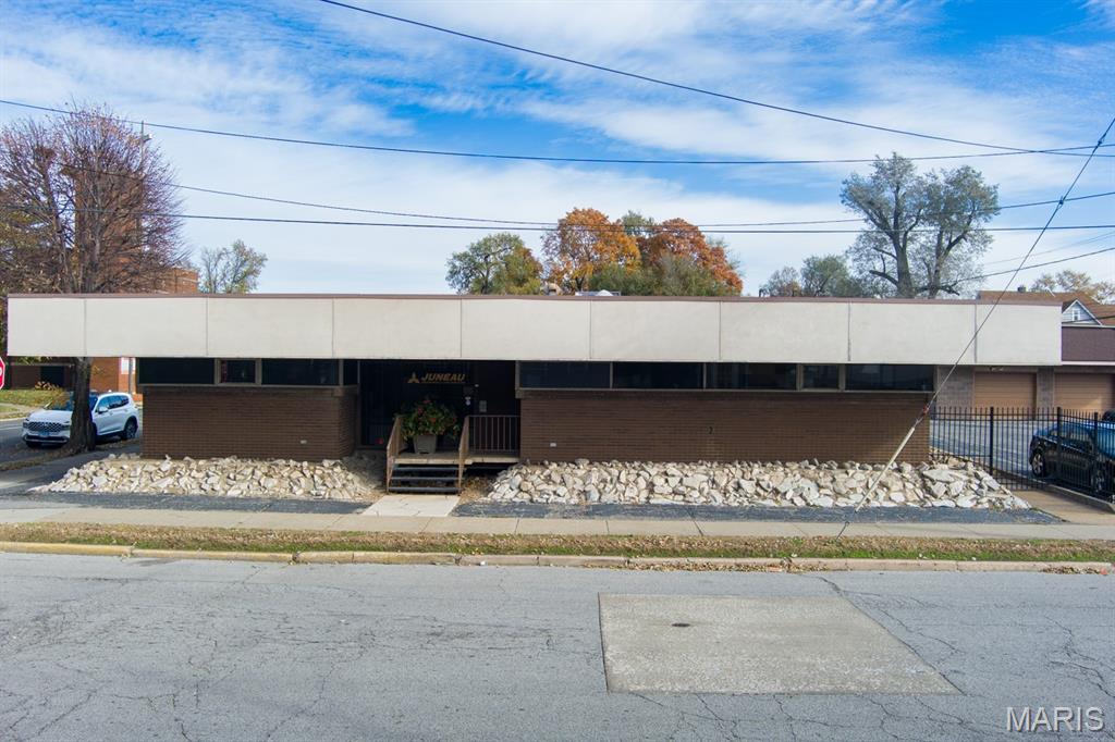 Exceptional opportunity to own a well-maintained commercial property in the heart of Granite City. Built and owned solely by Juneau Associates, Inc., P.C. since 1969, this solid, quality-constructed building has been cared for with pride and is in excellent condition. The property includes three parcels—22-2-20-18-17-305-001, 22-2-20-18-17-305-002, and 22-2-20-18-17-305-003—and offers approximately 4,000 sq ft of flexible space, ideal for professional offices, service businesses, or redevelopment within the C-4 Central Business Commercial District.The site provides 36 off-street parking spaces (18 on blacktop and 18 on concrete), a detached concrete-block two-car garage, and an enclosed fenced area with a wooden shed for additional storage or utility use. Thoughtful planning includes a green-space buffer adjoining residential lots for privacy and visual appeal. Located within the Southwestern Madison County Enterprise Zone, the property may qualify for local business incentives. Additional updates include a new A/C unit installed in June 2024 (Permit #2024222056). Property corners will be surveyed and visibly marked prior to closing.
Sold As-Is, this property combines long-term integrity, generous parking, and excellent zoning versatility—ready for its next owner’s vision.
