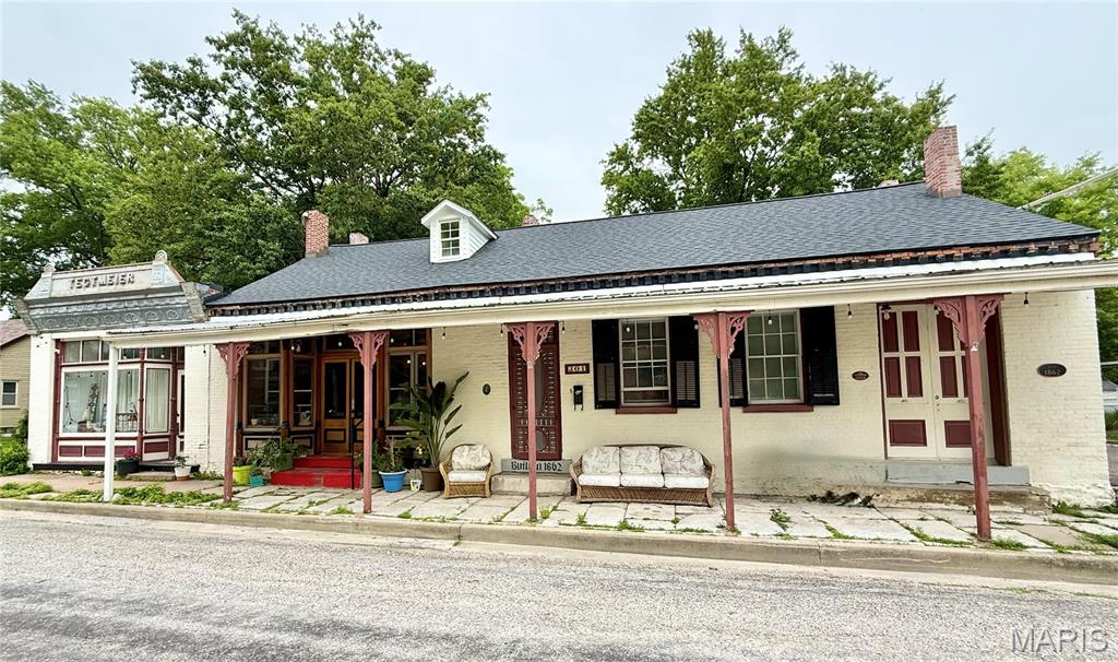 Historic Millstadt Property Built in 1900, Wood Flooring Throughout Main Living Areas, 15 x 14 Living Room Features Corner Wood Burning Fireplace, 15 x 14 Kitchen Provides Gas Range with Built In Microwave, Dishwasher, Garbage Disposal and Refrigerator, Hallway Bathroom, 12 x 10 First Bedroom, 25 x 17 Second Living Room, 17 x 15 Family Room, 17 x 12 Dining Area, 17 x 13 Second Bedroom and 13 x 12 Third Bedroom, Washer and Dryer Connections, Off Street Parking and Double Lot, Available Now.