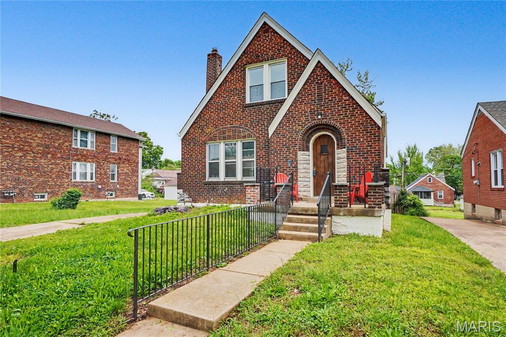 Timeless architecture. Thoughtful craftsmanship. Surprisingly spacious.

For Lease, Lease Purchase, or Sale! A rare blend of classic University City charm and thoughtfully executed modern design, this beautifully transformed brick bungalow has been extensively renovated through fully permitted improvements while preserving the architectural character that makes homes of this era so enduringly desirable.

From the moment you arrive, the home makes a lasting first impression. A storybook arched stone-and-brick entryway, warm wood front door, and striking masonry details showcase the timeless craftsmanship that sets this home apart before you ever step inside.

The interior is equally captivating. Refinished hardwood floors, graceful arched openings, original windows, and a stunning new fireplace create a warm, light-filled living room where historic character and modern comfort exist in perfect harmony. Just beyond, the spacious formal dining room easily accommodates large family gatherings, holiday celebrations, and dinner parties with seating for up to twelve.

Designed for the way people live today, the completely reimagined kitchen offers generous workspace, abundant cabinetry, new appliances, and stylish finishes that make everyday living as enjoyable as entertaining. Two spacious main-level bedrooms and a beautifully updated full bath provide exceptional flexibility, including one bedroom featuring custom built-in bookcases that add both charm and functionality.

The thoughtfully designed upper level has been transformed into a true owner's retreat. The spacious primary suite offers the privacy buyers crave with a beautifully appointed ensuite bath and walk-in closet, while an additional oversized bedroom provides versatile space for family, guests, or a dedicated home office.

The walk-out lower level further expands the home's versatility with a large family room, an additional full bathroom, and an oversized bonus room perfectly suited for a media room, fitness studio, executive office, hobby space, or even a fifth sleeping area.

Step outside to discover one of the property's most unexpected features—an expansive, fully fenced double lot. A covered rear deck finished in warm natural wood overlooks an outdoor space rarely found in University City, offering abundant room for entertaining, gardening, pets, play, or simply enjoying a quiet evening at home.

Perfectly positioned near parks, restaurants, shopping, Washington University, Clayton, Forest Park, and the continued revitalization and investment along the Page Avenue corridor, this home combines timeless architecture with modern convenience in one of the region's most established communities.

Thoughtful design, quality craftsmanship, distinctive character, and enduring attention to detail are the reasons this home was selected as part of the Penthouse Crafted Collection.