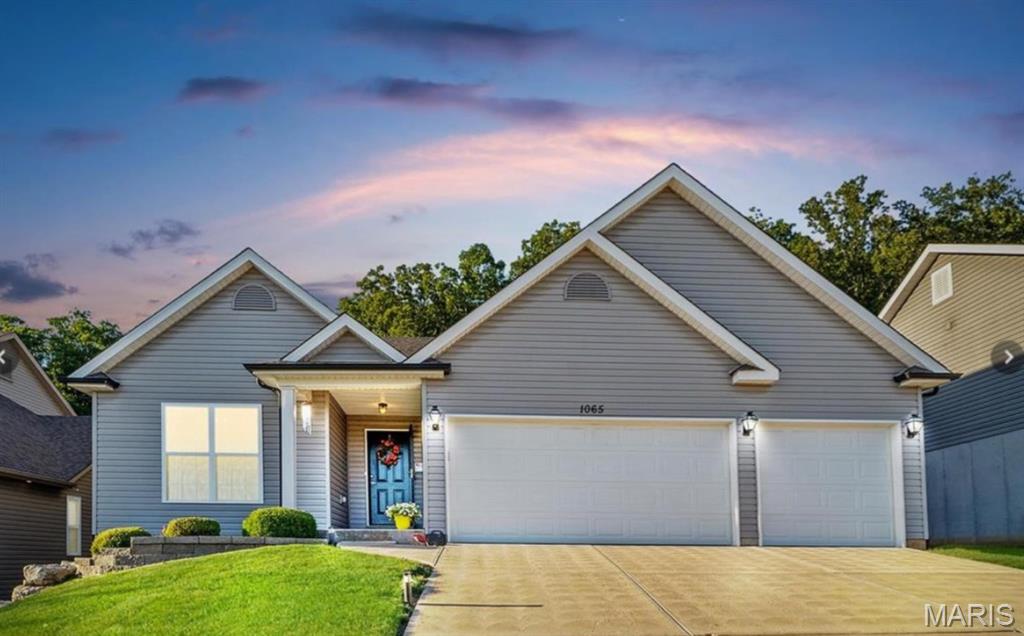 Designed for comfortable everyday living, this inviting home offers an open floor plan with a bright, easy flow between the main living spaces. Granite countertops, custom cabinetry, newer appliances, and a kitchen island large enough to seat the whole crew will make this kitchen the heart of the home.  While the vaulted ceilings make this already large space feel even larger, the solid oak hand scraped floors warm it up with style and durability. Enjoy the large primary en-suite with a spa inspired luxury soak tub.  2 additional bedrooms and a full bathroom, along with the convenience of main floor laundry, complete the main floor.  Make your way down to the beautifully finished full basement.  Featuring 3D faux brick accents, stained concrete floors, with 2 closets complete with barn-style doors, and a third full bathroom.  Perfect for get togethers and entertaining.  Back upstairs, step outside the French doors to the professionally landscaped, fenced-in yard with a 16x16 granite patio giving you a private oasis to relax and unwind.  Finish it up with a 3-car garage that provides valuable parking and storage, and you have a home that is both practical, welcoming, and all within walking distance to Seckman schools!