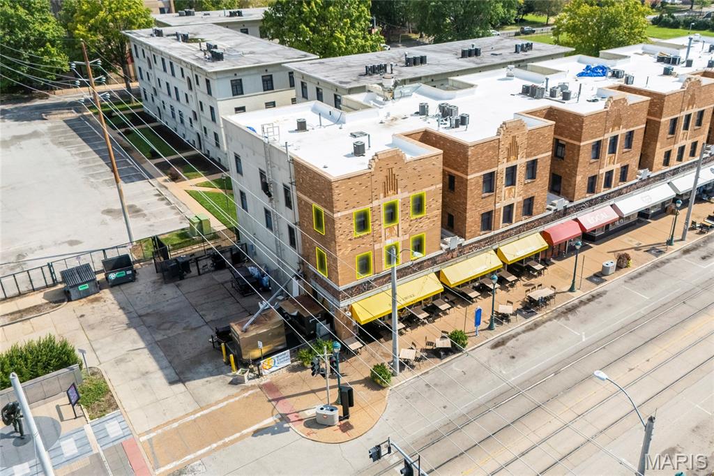 Experience true Delmar Loop living at 603 Westgate Avenue #D, a stylish two-level corner condo in the heart of University City. Offering 2 bedrooms, 2.5 baths, 1,194 square feet, high ceilings, hardwood floors, new carpet installed in 2026, and no resident neighbors directly above or below, this light-filled home delivers a rare blend of character, comfort, security, and walkable St. Louis lifestyle appeal.

The open main level is designed for everyday living and easy entertaining. The spacious kitchen features granite countertops, stainless steel appliances, gas range, slate tile flooring, walk-in pantry, and breakfast bar seating that opens naturally to the dining area. Living room windows overlook Delmar Blvd and The Loop, with views toward Chuck Berry Plaza and Blueberry Hill. A main-level powder room adds practical convenience.

Upstairs, the primary suite includes a private full bath and large walk-in closet with custom St. Louis Closet Co. built-ins. The second bedroom also offers custom closet organization and is served by a full hall bath, creating flexibility for guests, roommates, work-from-home space, or daily use. Additional buyer-friendly updates include in-unit second-floor laundry, new water heater installed in 2026, double-hung vinyl windows, and two dedicated basement storage lockers.

Parking is a major advantage, with two assigned spaces: one in the secured rear gated lot and another in the convenient front circle drive. The community also offers locked building entry, bike racks, shared green space, patio, and grilling area. HOA benefits include grounds, exterior, common areas, snow removal, sewer, trash, water, and other important maintenance items.

Step outside and enjoy one of the region’s most iconic neighborhoods. Located above Salt + Smoke and across from Blueberry Hill, you are moments from Fitz’s, Corner 17, Mission Taco, United Provisions, CVS, the public library, farmers market, The Pageant, Moonrise Hotel, coffee shops, restaurants, bars, live music, nightlife, and MetroLink. Washington University is a straight shot down Melville Avenue, while Forest Park, the Saint Louis Zoo, Clayton, downtown sporting events, and major cultural destinations are just minutes away.

Already passed the stringent University City occupancy inspection. For buyers searching for a walkable University City condo with secure parking, storage, updated features, distinctive views, and authentic Delmar Loop energy, this one stands out.