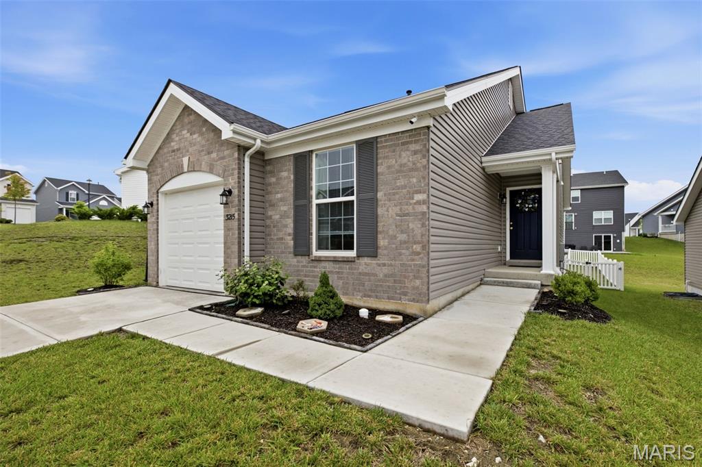 This beautiful Summerfield Ranch offers 2 bedrooms, an open concept kitchen / living room, perfectly designed for comfortable living and effortless entertaining. From the moment you step inside, you’ll love the vaulted ceilings, oversized 6-foot windows, and luxury vinyl plank flooring that fill the main living areas with warmth and natural light. The kitchen is both stylish and functional, featuring 42” cabinetry with added hardware, Cambria countertops, stainless steel GE appliances, and a large peninsula with an extended breakfast bar ideal for hosting or casual dining. The spacious primary suite includes 2 closets and a bath with a walk-in shower. Thoughtful upgrades throughout the home include a craftsman front door, upgraded lighting, a bay window, added drawer space in the bathroom, and main-floor laundry for everyday convenience. The lower level offers an egress window providing a fantastic opportunity for future finish and added living space. Additional upgrades and improvements include Brand New Roof (2025), fence, blinds Installed. Truly move-in ready and meticulously maintained, this home combines quality finishes, smart upgrades, and room to grow all in one beautiful package.