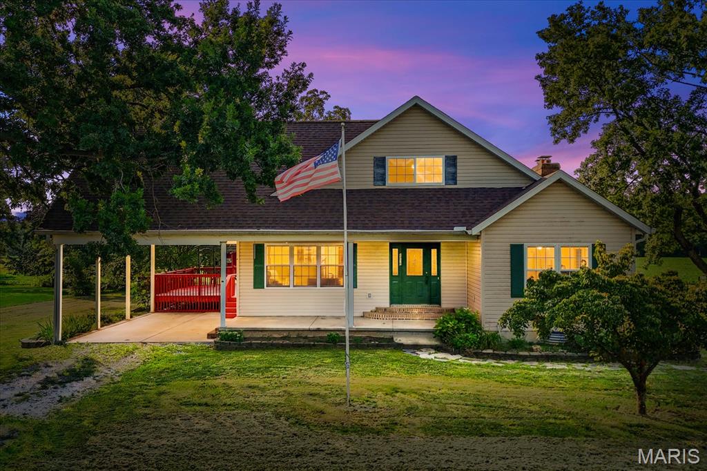 Welcome to 8718 D. Road, Waterloo, IL – Where Home, Hobby & Opportunity Come Together! Why settle for one parcel when you can own two? Situated on a total of 1.16 acres, this unique property combines comfortable country living with incredible space and possibilities. The main parcel features a custom-built 1.5-story home built in 2002, stocked pond, cattle corral, and an adorable log playhouse for the kids. The second parcel features an impressive 60' x 90' steel-constructed Warehouse offering exceptional potential for business, hobbies, equipment, storage, or recreational use.  Step inside the home to a welcoming foyer. To the right is the spacious primary suite with his-and-her walk-in closets and a private bath featuring a walk-in shower and jetted Jacuzzi soaking tub. To the left is an oversized formal dining room perfect for entertaining. The adjoining eat-in kitchen offers abundant oak cabinetry, breakfast bar, white appliances (included), and plenty of counter space. A sliding door leads to the freshly painted 16' x 20' deck overlooking the property.  The expansive living room features a cozy wood-burning fireplace, while a convenient half bath completes the main level. The home also features zoned heating and cooling for added comfort.  Upstairs you'll find two generously sized bedrooms, a full bath, oversized utility/HVAC room with excellent storage, and a spacious bonus room that could serve as a fourth bedroom, office, playroom, or hobby room (no closet). New carpeting was installed in the hallway and one bedroom in 2025.  
The unfinished lower level offers 9' poured concrete walls and two large daylight windows, providing excellent potential for future living or recreational space. The room beneath the front porch could also serve as a storm shelter or safe room.  
Recent improvements include a new roof, LeafGuard gutters, new roof on the detached shed, and a hot water heater approximately two years old. The original HVAC system has been professionally serviced annually. The home is connected to public water, and the water softener will remain. Now for the Warehouse—a standout feature of this property! This 60' x 90' steel-constructed building includes a loading dock, basement, elevator, office area, and approximately 2,600 sq. ft. of storage area on the warehouse floor. It also features a 30,000-gallon cistern and deep well, both of which need some work. The elevator is in need of an electrical switch. A walk-in cooler is located in the basement; its condition is unknown. A new 200-amp electrical service has been installed, with some rewiring completed. The Warehouse has also been recently painted and the roof freshly sealed.  Outside, enjoy a stocked pond with bluegill, bass, and channel catfish, along with a corral in the rear for cattle, providing even more possibilities for this one-of-a-kind property.  According to the seller, the property is zoned Residential/Commercial, creating added flexibility for future use. Properties combining a custom home, two parcels, steel Warehouse, pond, cattle corral, storage, and Residential/Commercial zoning don't come along often. Whether you're looking for a place to call home, room for your hobbies, or space to operate a business, 8718 D. Road offers an opportunity you won't want to miss!