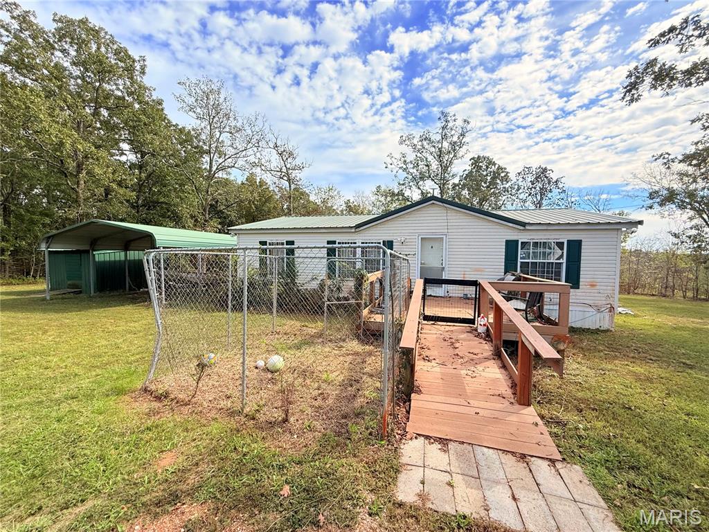 Discover peaceful country living with this manufactured home on 3.03 +/- acres in Wappapello, MO, just minutes from the lake and a public boat ramp. This property is being sold as-is and includes Starlink internet, Ring cameras (interior and exterior), a private pond, a carport, a storage shed, and some existing furniture. Enjoy the perfect blend of privacy and convenience—ideal for a second home or full-time lake living.