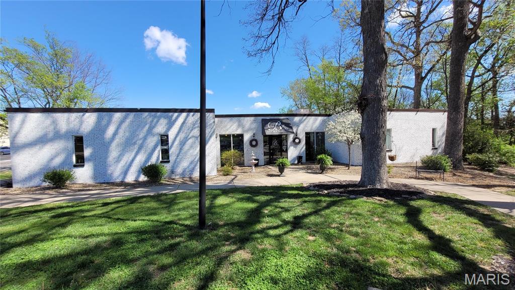Beautiful Full Brick building approx 7890 sf large on 1.73 acres near Cave Springs rd on Mexico.  High Traffic count and great visibility. Building is currently divided into 3 distinct rental units- these units can be combined, if desired.  Front part of building is currently used as a Hair Salon. The rear part of the building is general office space with 1 office & 2 bathrooms.  The lower walkout space is also general office with 3+ offices, bathroom & storage area.  3 Large & separate parking areas for each unit (over 40 parking spots overall). Newer installed roof.  Excellent location off Mexico Rd and Venture Rd-- near Cave Springs Exit next to St. Johns Bank.  Unique Setting for your business or take over existing lease agreements. Building used to be St. Peters City Hall. Location: City, Corner Location, High Traffic