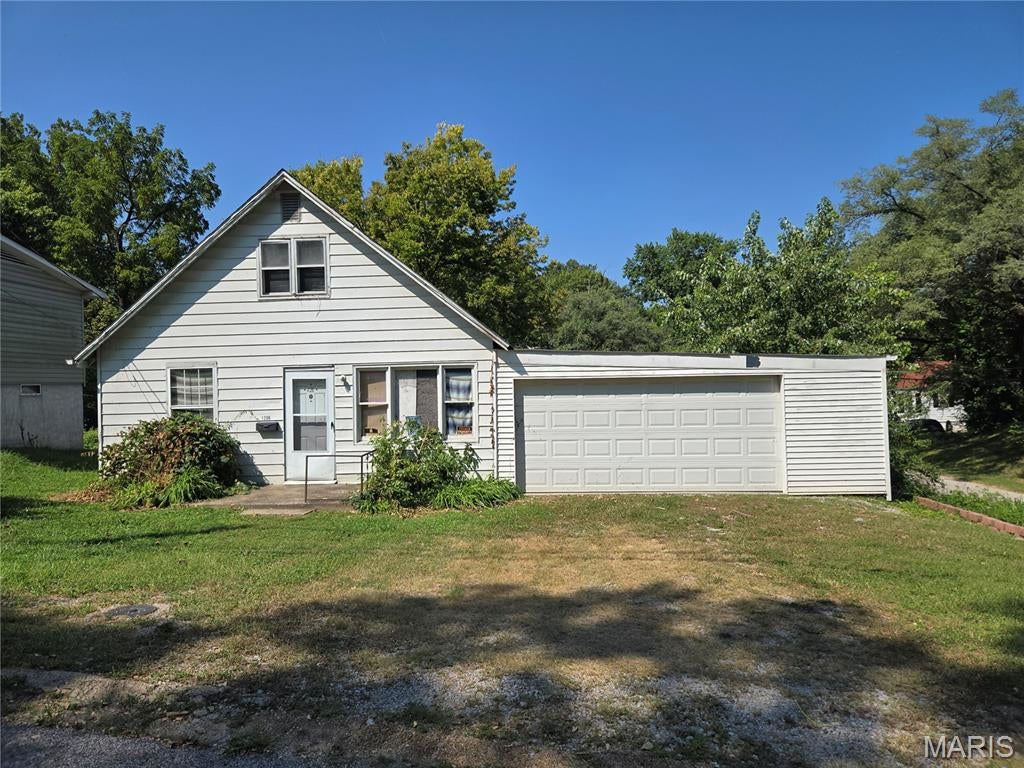INVESTOR SPECIAL!  Nice corner lot with a great backyard.  This home has a lot of potential!  Two main floor bonus rooms add some extra possibilities for growth.  Two bedrooms upstairs, one with a walk-in closet.   Nice size kitchen open to the living room.  Attached 2 car garage is oversized and great for projects!  Home is being sold strictly as-is.  All items left at the property convey with the property.  Gas and water are off and buyer will be responsible for occupancy.  Two sheds in the back will stay, as does the solar panels that are owned.