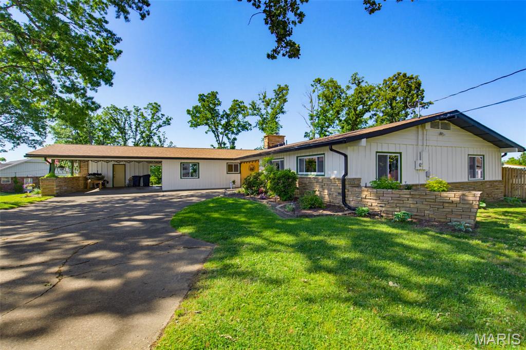 Stunningly updated and full of character, this beautifully remodeled 4 bed/3 bath home offers the perfect blend of charm, comfort, and modern convenience in a quiet setting. Nearly every inch has been updated with new lighting fixtures, paint, solid core doors, tinted windows for added privacy, and gorgeous porcelain flooring in family room, dining room, and kitchen. The kitchen also features granite countertops, custom cabinetry, and updated finishes, while the main and primary baths boast custom vanities, granite countertops,  and a brand-new luxury primary bath renovation. Cozy up by the fireplace or relax year-round on the screened-in porch with all new screens and included outdoor TV.

Major updates include a brand-new roof on the entire home, new gutters, brand-new HVAC system, new fencing, and warranties on the windows and HVAC for added peace of mind. Appliances stay, including the washer and dryer, making this home truly move-in ready. Additional features include cellulose blinds, Pecky Cypress accents adding unique character, and thoughtful updates throughout every space.

Outside, the property is a gardener’s dream with peach, nectarine, and apple trees, grape vines, blackberry, blueberry, and elderberry bushes, plus multiple raised garden beds ready for the next season. The hot tub and fire pit create the perfect outdoor retreat to enjoy this peaceful property. Character, charm, and updates are everywhere you look in this one-of-a-kind home!