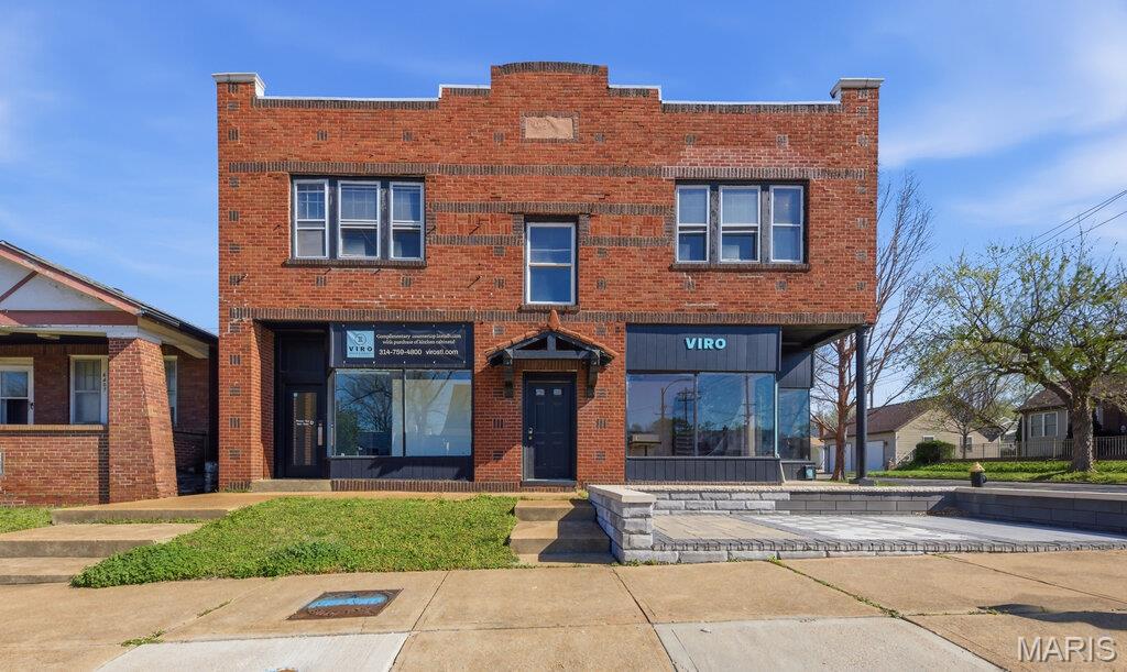 Great investment opportunity at 6401 Arsenal in 63139 offering a versatile mix of commercial and residential space all within one building. The property features two storefronts on the main level along with two upstairs apartments, each with private entrances for added convenience and separation. Ideal for an owner occupant or investor looking to generate multiple income streams. The building includes a fenced and gated parking lot, plus a large covered deck at the rear for the apartment units. Flexible layout allows for potential use as two separate commercial spaces. Located in a high visibility area with strong rental and business potential.