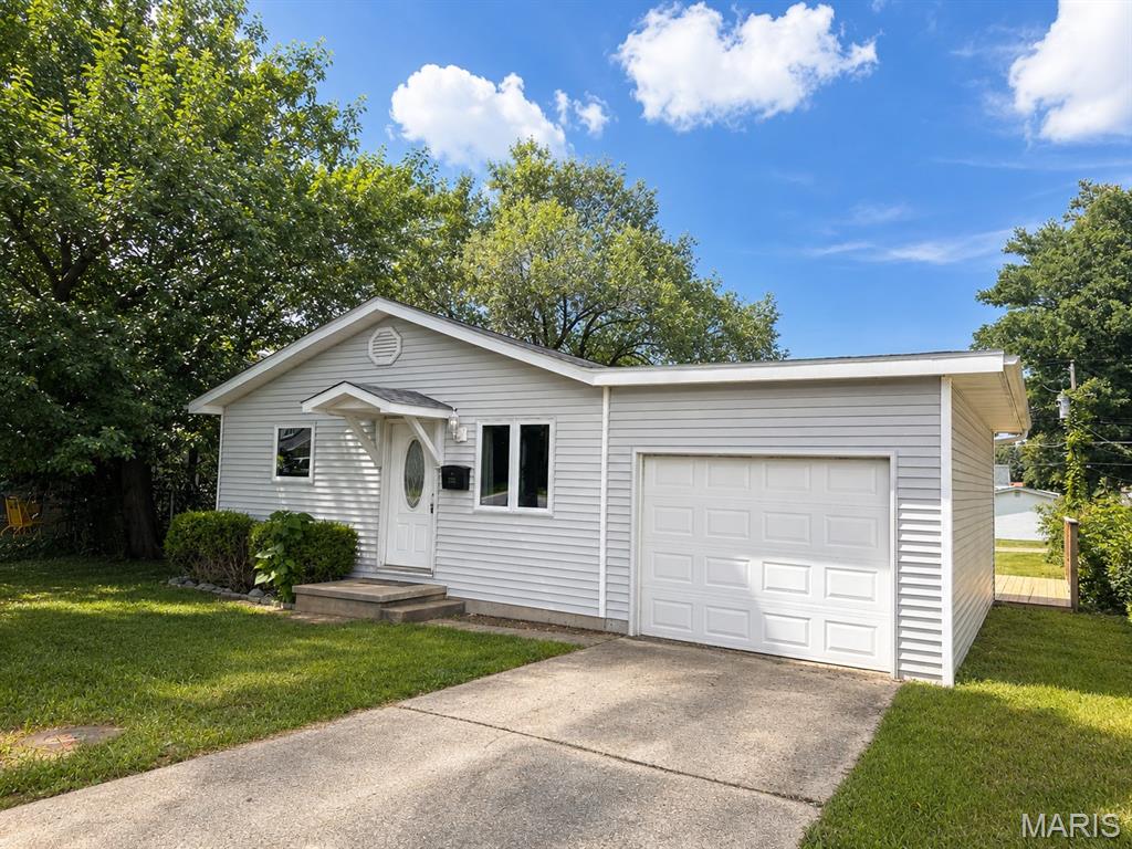 This move-in ready 3 bedroom, 2 bath home in the heart of Sullivan offers comfort, function, and everyday convenience. The open living area flows into a stylish kitchen featuring granite countertops, stainless steel appliances and modern finishes. The primary suite includes a private bath and spacious walk-in closet, while two additional bedrooms provide flexibility for family, guests, or a home office.

You’ll also appreciate the oversized laundry room, attached one-car garage, and large backyard with plenty of room to relax, play, garden, or entertain. A new deck adds even more outdoor living space. Conveniently located close to schools, shopping, dining, and local amenities, this move-in ready home is waiting for you.
