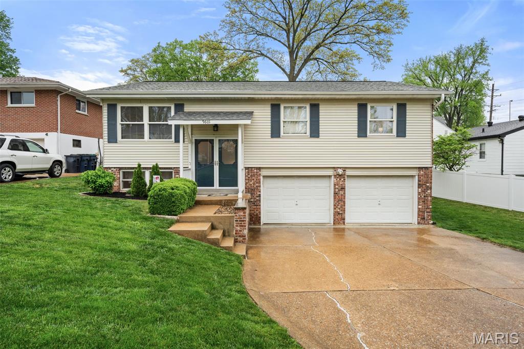 This ain’t our first rodeo in Crestwood… but 9601 Gallop Lane might be our favorite ride yet. Sittin’ pretty in the Lindbergh School District, this 4 bed, 3 bath split-level from 1977 is off to a strong start and frankly… not horsin’ around. Step inside and you’ll find gleaming hardwood stairs, tons of natural light and a main living room that is bright, open + ready for whatever setup you’ve been saving on Pinterest. Big windows, easy flow + a space that just *works* without overthinking it. The kitchen has plenty of counter space, hard surface floors, white cabinetry and room to actually sit down and enjoy a meal. It leads you right out back, which makes hosting, grilling or pretending you’re a “cook at home every night” person very doable. Down the hall, four spacious bedrooms give everyone their own corner of the house. The primary suite brings a large walk-in closet and an en-suite with a walk-in shower. The hall bath has been recently updated with a shower/tub combo, oversized vanity, clean finishes + enough storage to hold everything you’ve been hiding under the sink at your current place. Downstairs, the lower level is your bonus round. Playroom, office, movie nights, second living room… giddy up and take your pick. There’s another full bath down here too, so no one’s running stairs mid-movie. The storage room goes on and on with a washer/dryer setup and space that actually gets used. The oversized 2 car garage keeps all your gear, tools and yes… your “gizmos and gadgets” in one place. Out back, the real *thoroughbred* shows up. A large deck with room to dine or lounge + a backyard full of green space that’s ready for PLAY (dogs or humans) for anyone who just wants a little room to roam. And the location? It wins by a nose. 
Hear this.. WALK to shopping, gyms, grocery stores, ice cream shops, coffee, parks, schools and more.  Quick access to major roads + highways makes getting anywhere easy, but you’ll *probably* just want to stay right here. Big ticket items are covered too with a roof under 5 years old, main bath updated, water heater that’s 5 years old and AC just 2 years old. Gallop on over… this one’s got legs. Cheers!