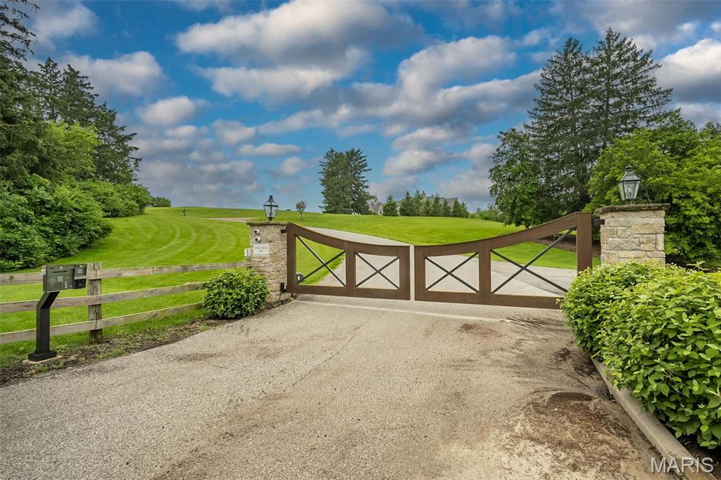 A rare and extraordinary opportunity to claim one of the last true estate parcels in the prestigious Municipality of Huntleigh — 5.56 private acres within the exclusive Bridle Ridge Estates, where properties of this scale simply do not come available. Set within a gated community and surrounded by similarly sized estate parcels, this magnificent homesite offers the kind of privacy, scale, and natural beauty that cannot be manufactured. A scenic creek winds peacefully through a portion of the property, lending a park-like character to the land and a natural distinction that sets this parcel apart from anything else in the market. At over 242,000 square feet, the canvas here is extraordinary — ample for a signature estate residence, guest accommodations, sport courts, a pool and pool house, equestrian amenities, or any vision you choose to bring to life. Zoned 30A within the award-winning Kirkwood R-VII School District and situated within the quietly exclusive community of Huntleigh, this is not merely a lot — it is the foundation for a legacy. Opportunities of this magnitude, in this location, are measured in years between appearances. The time is now.