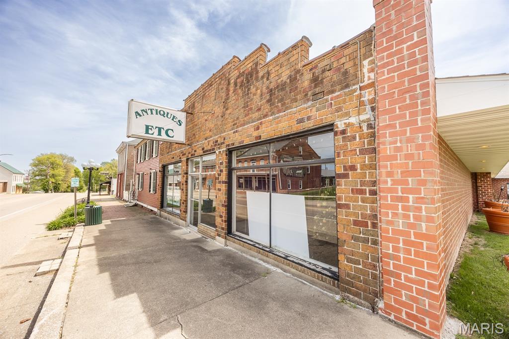 Prime commercial building in historic Lebanon, IL, offering excellent visibility, steady traffic, and strong long term potential. This 5,514 sqft structure has received major capital improvements, including a new roof, updated windows, tuck pointing, a gas and oil separator, and plumbing tied into the main sewer line. These upgrades significantly reduce near term maintenance and create a solid foundation for redevelopment or immediate occupancy. The property sits on a 0.28 acre lot with public utilities available and convenient access from multiple directions.  Located within downtown Lebanon’s active commercial corridor, the site benefits from consistent local traffic, proximity to established businesses. This is an excellent opportunity for an owner user or investor seeking a well-positioned asset with strong visibility and adaptability.