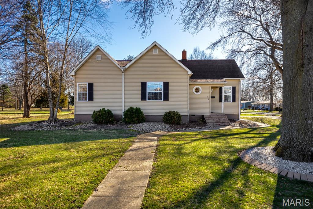 Well-maintained 3 bed, 1.5 bath home situated on a spacious 0.5+ acre corner lot with an attached carport and detached 2-car garage. This home offers a great combination of character and functionality with hardwood flooring, tall ceilings, and an open living/dining room layout ideal for everyday living and entertaining. The large 16x15 eat-in kitchen features tile flooring, stainless steel appliances, and wood cabinetry with plenty of space for dining. The full bath features tile flooring and a custom tile surround. Additional highlights include a welcoming entry foyer, mud room, vinyl windows, and a full basement providing excellent storage or future finishing potential. Outdoor features include a large deck and above-ground pool, offering great space for entertaining. Major updates include newer electrical wiring with a 100 amp breaker panel and a gas water heater replaced in 2024. Home is equipped with a gas furnace.