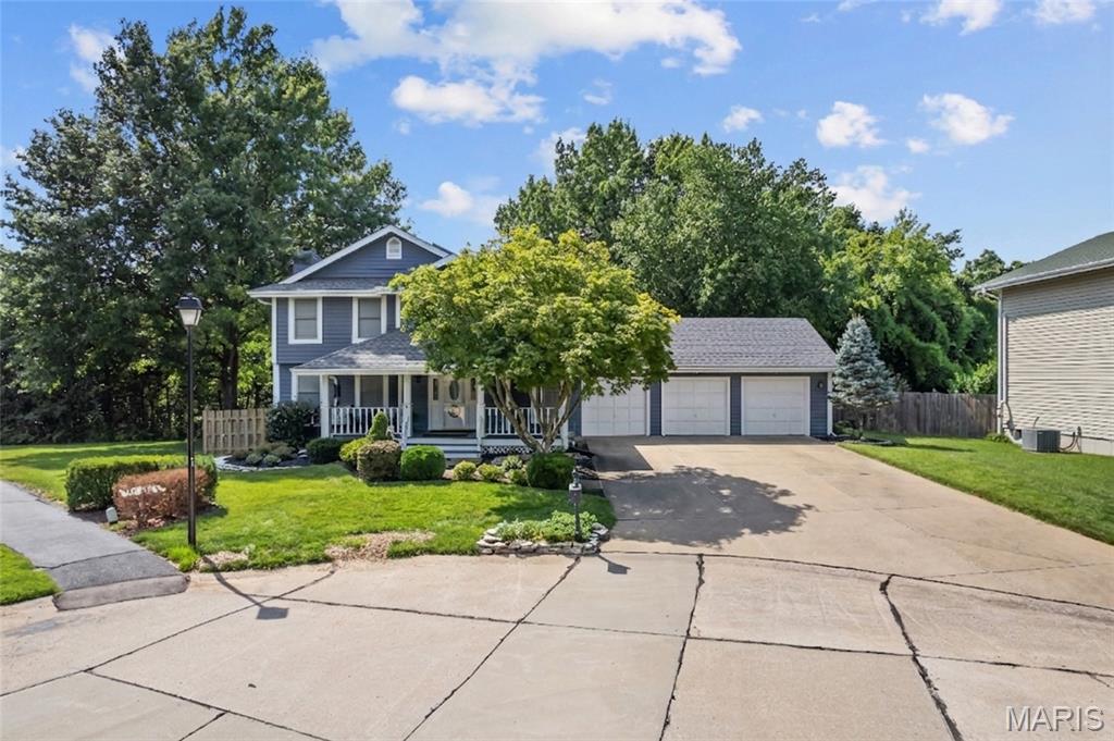Beautifully updated home in River Bend Estates with 3 car garage. Walking up to the home, notice the beautiful landscaping and covered wrap around front porch.   Entering the home a spacious great room with crown molding and gas fireplace with modern stone surround and barnwood mantel with granite hearth greets you. Notice the beautifully updated luxury plank flooring, as the Great room flows to a spacious dining room. Your upgraded re-designed kitchen is stunning with luxury vinyl plank flooring, updated lighting, 42" Shaker cabinets, tile backsplash and cambria countertops.  Breakfast room features a custom wall of cabinets with a built in dining island, storage and ample seating for four. New Handrail and spindles complete the main floor with a modern/contemporary look.
Primary bedroom is spacious with  walk-in custom closet.  All bedrooms have Luxury vinyl plank flooring and updated paint. All windows have blinds built in. Roof was replaced in 2021.
Lower level features a recreation room with a wet bar, exercise room and full bath.
Large 3 car garage features a workshop area with storage wall cabinets.
Enjoy your fully fenced, tree lined backyard from the expansive deck or take a stroll on the walking trail to the lake for your enjoyment.  Located in the boundaries of the Francis Howell School District.