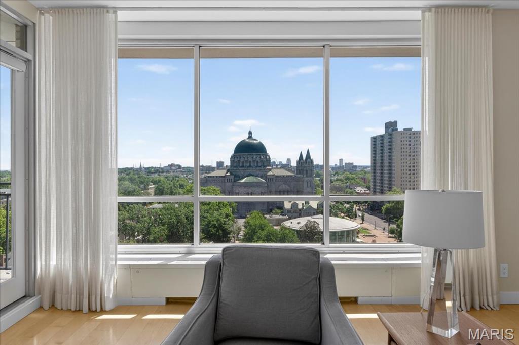 This stylish and sophisticated 2 bed, 2 bath unit with private terrace offers breathtaking views of the downtown skyline and dome of the St. Louis Cathedral Basilica. The living room and dining room combo features built-in bookshelves and floor to ceiling windows. The kitchen offers granite countertops and premium appliances. The spacious primary suite includes 3 closets, electric black out shades, and an updated bath with shower. There is an additional guest bedroom with custom-made plantation shutters that can also serve as a study/office. A second updated bath  includes a jacuzzi tub. This is a luxury, full service building with a doorman, and 24 hour security, a workout room, meeting room, and a rooftop patio with stunning 360-degree views. The monthly condo fee includes 2 unassigned parking spaces, heating, cooling, water, and Spectrum internet with premium cable channels included. Lindell Terrace is within a short distance to nearby shops, restaurants, medical centers, movie theater and Forest Park. This is a great opportunity to live in the historic and vibrant Central West End.