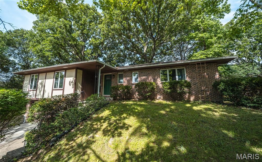 Beautifully maintained and excellent condition, this 4B/3B raised ranch is move in ready. over 2300 sq ft of living space. Large living room, separate dining room and beautiful kitchen, all with engineered Bamboo flooring. Painted creamy white cabinets and solid surface Quartz counter tops with stone backsplash, SS appliances. Living room has a woodburning fireplace. Main level has 3 bedrooms with 2 baths, 4th bedroom and 3rd bathroom, and laundry room on the lower level. There's a bonus storage room in the back of the garage.  The backyard is private with a large deck off the kitchen and a new full privacy wood fence.  Extra insulation was added to house in 2017. New circuit breakers updated in 2018. New sewer line from cleanout to main sewer was installed 2020, in 2026 sewer line from house to cleanout was replaced. Three new LL windows with covers installed 2019. This home has great appeal located on a cul-de-sac and central to shopping.