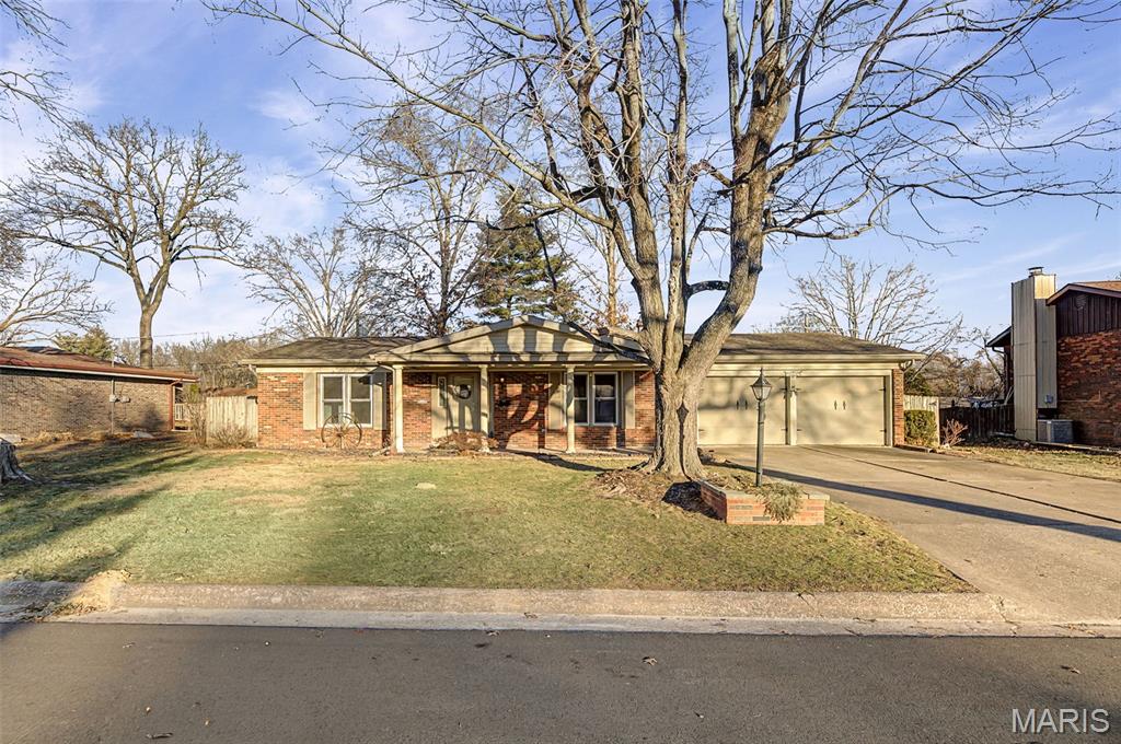 Welcome to this inviting home in the desirable Rock Gate Subdivision! Freshly painted throughout with brand-new carpet, this home offers a bright, clean, and move-in-ready feel. The functional layout includes main floor laundry, a comfortable separate family room, and spacious bedrooms, each featuring walk-in closets. The dining room opens to the backyard through sliding glass doors, leading to a patio, perfect for outdoor dining or relaxing. Enjoy the privacy of a fully fenced backyard. The unfinished lower level provides excellent potential for future living space and is already plumbed for a third bathroom.  Home has passed the Godfrey occupancy inspection.