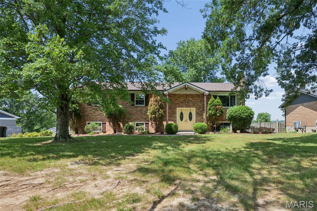Welcome home to 3425 Tenbrook Rd., Arnold, MO 63010! This beautifully maintained split-level home sits on a spacious half-acre, mostly level lot and offers exceptional curb appeal with its attractive brick veneer exterior. The rear-entry tuck-under 2-car garage and oversized driveway provide ample parking for family and guests.

Inside, you'll find 3 bedrooms and 2.5 bathrooms, along with an all-electric setup and gas lines available outside for future conversion if desired. The kitchen comes complete with stainless steel appliances, including the refrigerator, and the washer and dryer stay, making this home truly move-in ready.  Finished lower level with abundant natural lighting, a family room, laundry room, storage room, half-bath, bar area and beautiful walk-out to the patio and spacious backyard.

Enjoy the perfect blend of comfort and convenience with easy access to shopping, restaurants, parks, and major highways. With its generous yard, desirable location, and included appliances, this property offers a wonderful opportunity to enjoy both indoor and outdoor living.