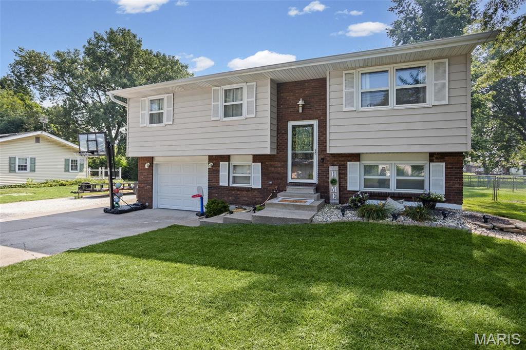 Welcome home to 23296 Glenda Ave., a move-in ready split-foyer home in a fantastic location! From the moment you step inside, you’ll appreciate the inviting open floor plan featuring a spacious kitchen and dining area. Just off the kitchen, enjoy your morning coffee or evening gatherings on the beautiful deck overlooking the backyard. The upper level offers three comfortable bedrooms and a full bathroom, providing a functional layout for families or guests. Downstairs, you’ll find a large family room, a second full bathroom, laundry area, and additional flex space that’s ideal for a home office, workout room, or play area. The attached garage adds even more convenience. Outside, the fully fenced backyard is ready to enjoy, complete with two single gates and one double gate for easy access. The sellers have the lawn professionally treated six times a year by FS, giving you a beautiful lush, green yard. Need extra storage? The impressive 16’ x 26’ shed provides plenty of room for lawn equipment, tools, hobbies, or outdoor toys. Move-in ready homes like this don’t last long, schedule your private showing today before it’s gone!