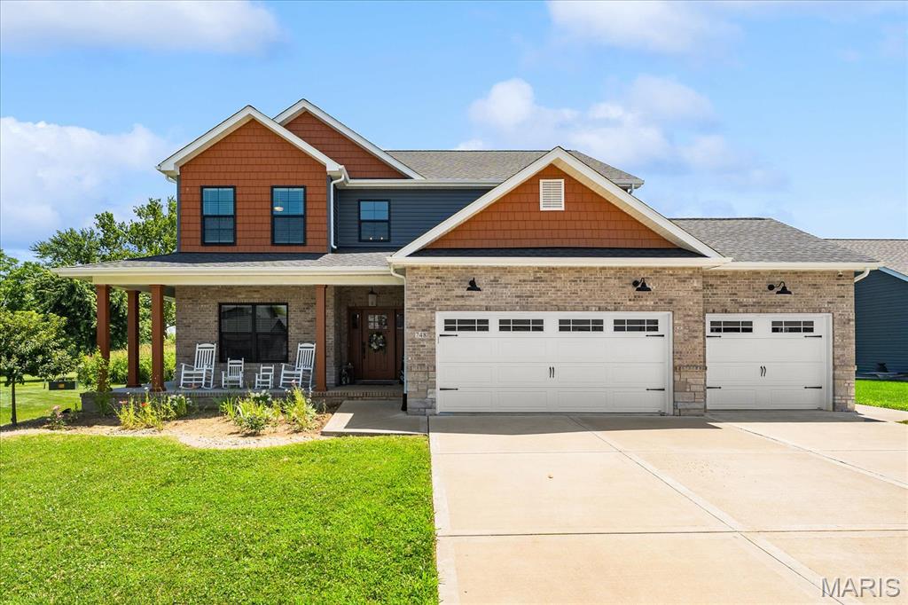 Can you picture it? Coffee on the wrap around front porch. Summer afternoons at the neighborhood pool. Evening walks on the trails. Backyard dinners under the covered patio. This is the kind of home that's built for making memories. With 4 bedrooms, 2.5 bathrooms, and a 3-car garage, this custom-built Savannah Hills home was thoughtfully designed with everyday living in mind.The kitchen is truly the heart of the home, featuring an oversized quartz island, gas cooktop with pot filler, double ovens, a farmhouse sink, smart Samsung refrigerator, beautiful two-tone cabinetry with gold accents, and plenty of room for everyone to gather. Need a little flexibility? The room behind the custom Dutch doors can become whatever you need it to be—a playroom, formal dining room, home office, or cozy retreat. Throughout the home you'll find hardwood floors, custom tile in the laundry room, french doors leading into the office, spacious walk-in closets, and a relaxing primary suite with a Jacuzzi tub and oversized walk-in shower.And here's a bonus you don't find every day—the home already includes a fully paid-off Vivint security system with cameras, video doorbell, smoke and carbon monoxide detectors, and window and garage sensors, giving you peace of mind from day one.The unfinished basement has plumbing and drywall started, so you'll have the perfect opportunity to finish it exactly the way you want. Open, spacious, generous size bedrooms and bathrooms. SPACE in all the right places.  If you've been hoping for more space in one of O'Fallon's favorite neighborhoods—with a community pool, walking trails, and a park—this one is definitely worth viewing! VA assumption would be considered. Ask agent for details!