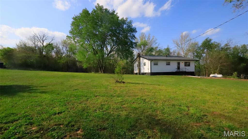 Welcome to 10011 Jordan RD, a delightful single-family residence built in 1971, where comfort and charm are ready to greet you. This inviting home is in "ready to move in" condition, promising an effortless transition into your new chapter. With 3 cozy bedrooms, there's ample space for everyone to find their happy place, whether for dreaming, creating, or simply unwinding. And with 2 full bathrooms, morning routines will be a breeze, ensuring everyone gets out the door with a smile. Are you ready to explore the possibilities and make this playful pad your very own? This home has been completely renovated, sits on 3 acres for room to roam, and a full walk-up unfinished basement for future family expansion!