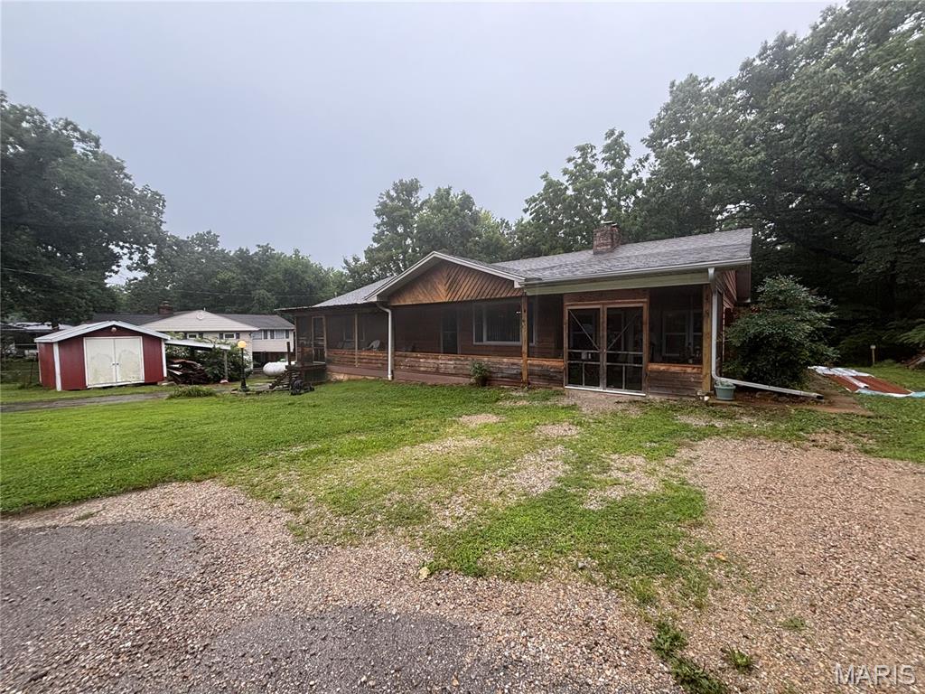 This  3-bedroom, 2-bath home offers the perfect blend of comfort, convenience, and outdoor living. Located adjacent to the lake, you'll enjoy peaceful surroundings and easy access to boating, fishing, and all your favorite outdoor activities. Step inside to discover an inviting open living area featuring a vaulted ceiling that creates a bright, spacious feel. Relax year-round in the enclosed screened porch—the perfect spot to enjoy your morning coffee or unwind after a day on the water. The home also features a full block walk out basement, providing abundant storage space or endless possibilities for a workshop, recreation room, or future finished living area. A standout feature of this property is the impressive 30' x 40' foam-insulated workshop, designed for year-round comfort and functionality. Whether you're working on projects, running a home business, or storing your recreational equipment, this versatile building offers abundant space for your boat, RV, ATVs, and more. The home also features a new roof installed in 2025, making it even more move-in ready. Whether you're searching for a full-time residence, a weekend lake getaway, or an investment opportunity, this property combines modern updates, exceptional storage, and an outstanding lake-adjacent location. Don't miss your opportunity to own this incredible property!