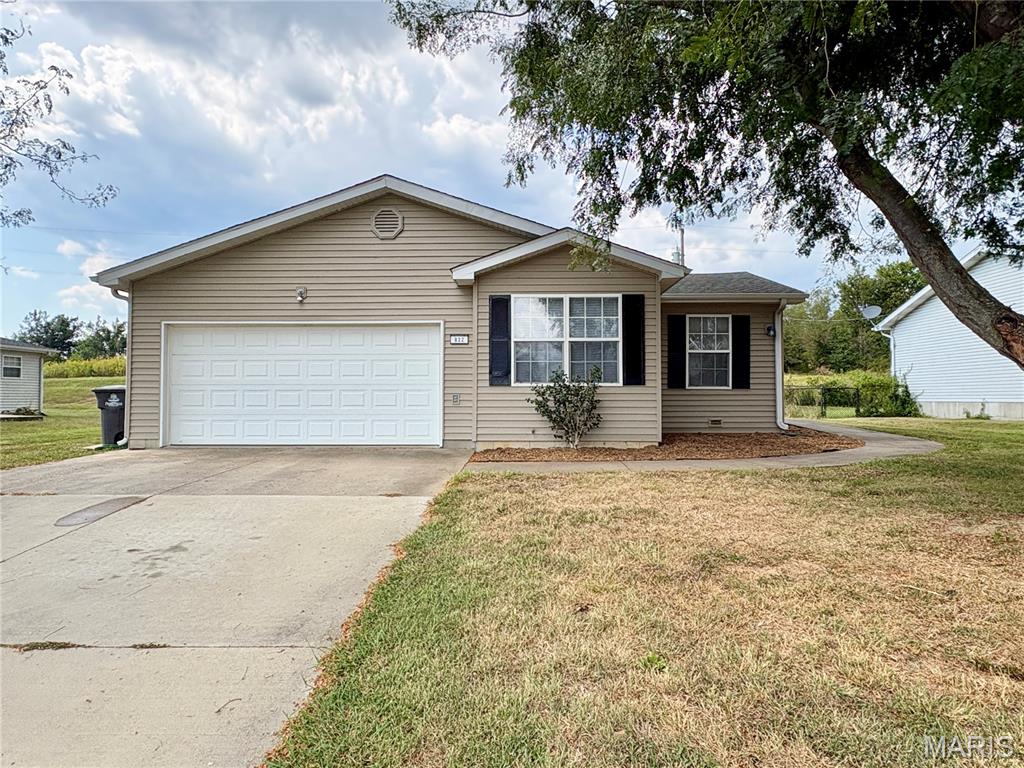 Comfortable, well-maintained, and ready for its next owner! This one-level home offers approximately 1,200 square feet of living space with a functional split-bedroom floor plan designed for both everyday living and privacy. The spacious primary suite is tucked away from the additional bedrooms and features a walk-in closet and private full bath. At the heart of the home, a generously sized living room provides plenty of space to relax or gather with family and friends. The bright eat-in kitchen is filled with natural light and offers a comfortable spot for casual meals, with appliances included for added convenience. Main-level laundry keeps everything easily accessible and adds to the practicality of this one-level layout. Recent improvements include fresh interior paint, new carpeting, updated lighting fixtures, select appliances, and other updates that give the home a clean, refreshed feel. An attached two-car garage with automatic opener provides convenient parking and additional storage. Outside, refreshed landscaping adds to the home's curb appeal, while the backyard patio overlooks open fields, creating a peaceful setting to unwind and enjoy the outdoors. Located on a low-traffic cul-de-sac within walking distance of the Perry Park Center, this inviting home offers a great combination of location, functionality, and move-in-ready appeal.
