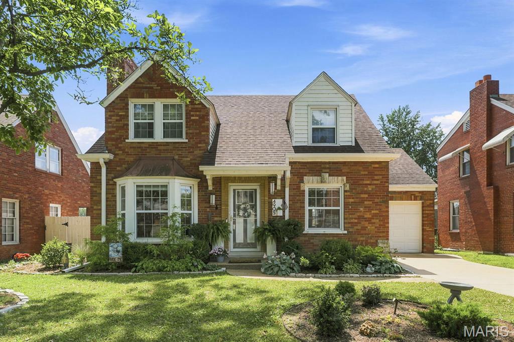 There is so much to love about this adorable St. Louis Hills beauty! You will love being within walking distance to Francis Park, Rockwell Beer Garden,Ted Drewes and local restaurants. This beautifully well-maintained 1.5 story brick home has everything you are looking for!  When you walk in, you will be greeted with a spacious living room with fireplace and dining room area, perfect for entertaining! Updated kitchen features stainless-steel appliances, granite countertops and custom cabinetry.  Main floor bedroom is perfect for your primary, guest bedroom or office space. Bonus family room filled with loads of natural light offers the perfect blend of comfort and versatility. Whether you're looking for a cozy media room or playroom, this flexible area is the perfect space to gather with family and friends. Main floor half bathroom completes the first floor. Upstairs you will find two spacious bedrooms with lots of closet space, full bath and linen closet. Downstairs you will find a huge walk-in closet space, additional living space or home gym area and laundry area w/ pantry space. One car attached garage with bonus workshop that is perfect for gardening supplies or the handy person in the family! Outside you will find a large patio- the perfect place for morning coffee, evening wine or weekend barbecues. Beyond the patio, you'll find an expansive, beautifully maintained yard offering plenty of room for gardening, pets to play, or even a future pool! Minutes away from shopping, parks, schools and restaurants. Recent updates include- partial new roof & gutters.