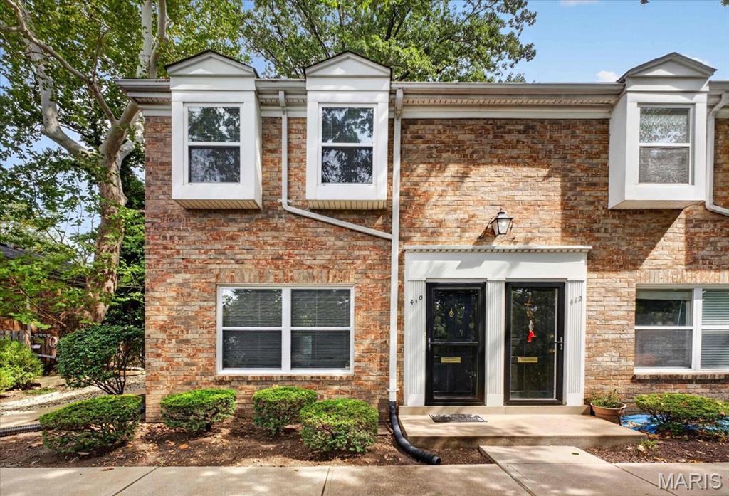Beautiful 2-bedroom, 1.5-bath townhome in the heart of Kirkwood, perfectly situated across from Kirkwood Park and just steps from vibrant Downtown Kirkwood. This low-maintenance home offers the perfect blend of comfort and convenience.

The bright kitchen features an inviting eat-in dining area and opens to a private patio through sliding glass doors, overlooking green space—ideal for relaxing or entertaining in a yard-like setting without the upkeep.

The main level includes a convenient half bath, while upstairs you’ll find two generously sized bedrooms with ample closet space and a full hall bathroom. The finished basement adds valuable extra living space, perfect for a home office, gym, or media room.

Additional highlights include designated covered parking, in unit washer, dryer, and refrigerator that stay with the home, and an unbeatable walkable location near parks, shops, and dining. Freshly painted, thoughtfully updated, and truly move-in ready, this is the perfect opportunity to start enjoying everything Kirkwood has to offer—this one won’t last long!