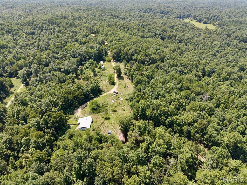 Bring your vision, your kids & your critters, and make this 10+/- acre property your own! This 3-bedroom, 1-bath home offers a great opportunity for those looking to create a hobby farm or peaceful country homestead. The home needs some TLC but features a newer well pump and plenty of potential. The acreage is mostly perimeter fenced, providing space for livestock, gardening, or other outdoor pursuits. Whether you're searching for a fixer-upper with room to grow or a rural retreat to customize, this property offers endless possibilities in a beautiful country setting.