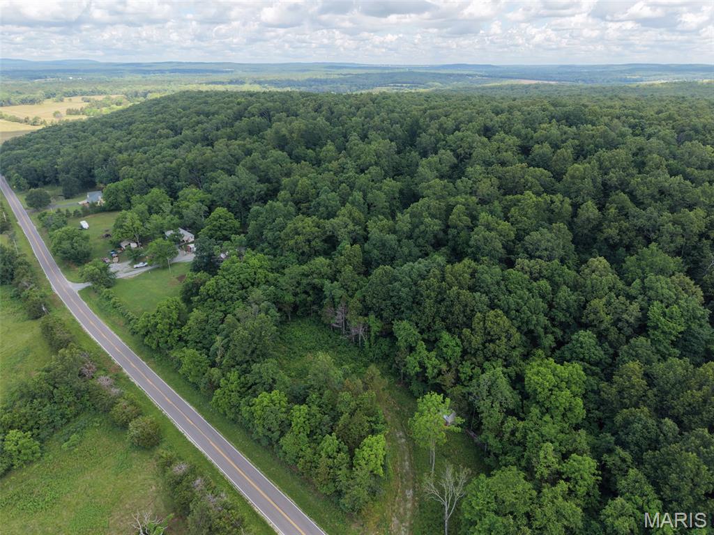 Discover the perfect mix of privacy and convenience with this beautiful 6-acre property just off H Highway near Farmington. Featuring rolling terrain and peaceful countryside views, this land offers an ideal setting for your dream home or recreational escape. Whether you’re looking to build, camp, ride ATVs, or simply enjoy the outdoors, the possibilities are endless. The property provides plenty of usable space while maintaining a quiet rural atmosphere. An existing outbuilding provides excellent storage space as well. Enjoy country living with quick and easy access to nearby shopping, dining, and everyday amenities!