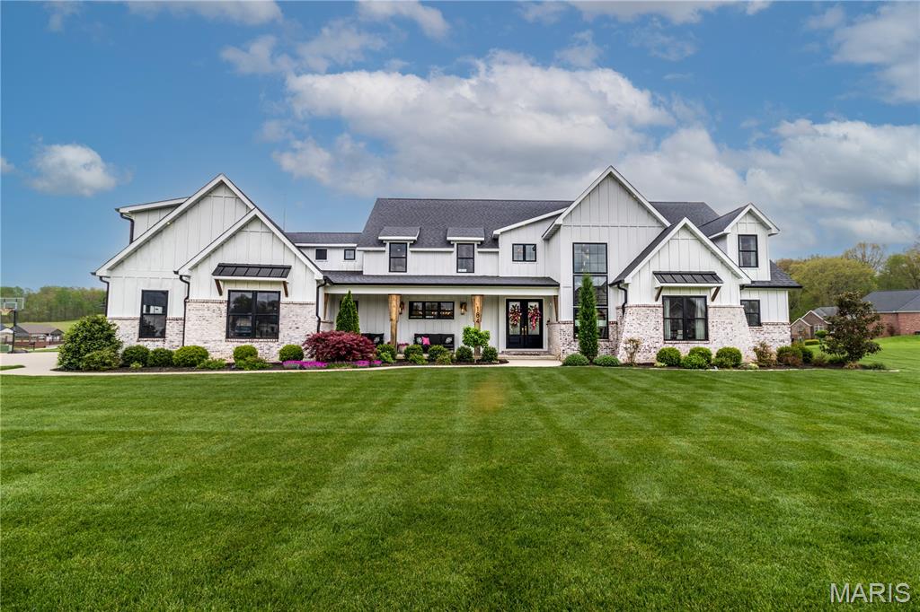 This stunning custom home is designed for both luxury and livability, offering ample space for everyone with six spacious bedrooms and six bathrooms, four creating on suites. Located in the Meadows of Whispering Oaks subdivision, this thoughtfully crafted home has high-end finishes throughout. The heart of the home features a gourmet kitchen complete with a gas stove, top-of-the-line appliances, and generous space for entertaining and everyday living. The beautiful, functional pantry boasts custom cabinetry and creates a space for storage and organization.  The main living areas flow seamlessly, leading to a screened-in porch that truly elevates indoor-outdoor living. Here, you’ll find a cozy gas fireplace and automatic screens, creating the perfect setting to relax or host guests year-round. The main floor, private primary suite is a true retreat, featuring a custom-designed bathroom and expansive closet tailored for both style and function. On the upper level, an additional large family room provides flexible space for lounging, media or play, while three additional bedrooms and three bathrooms ensure comfort and privacy for family and guests alike. Convenience meets practicality with an additional washer and dryer and custom built ins also on the upper level. On the lower level, find more finished space, with an additional bedroom and a full bath, as well as an additional room to be used for play or study. This level is completed with a wet bar to entertain and enjoy. Words can't describe this one... this is a home that perfectly balances elegance, comfort and thoughtful design. Don't miss the opportunity to live in a beautifully crafted home, in a wonderful location.